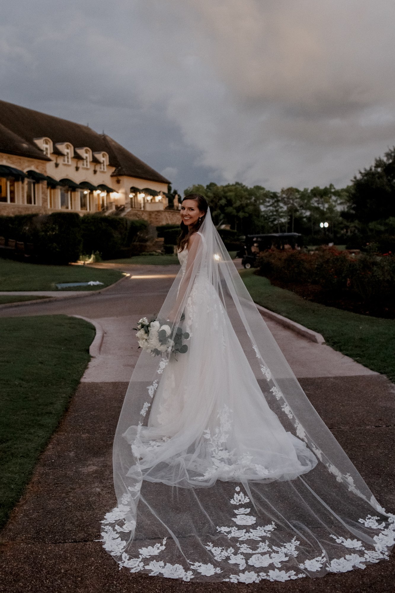 Bride's long veil. Bridal portraits. Wedding at Royal Oaks Country Club