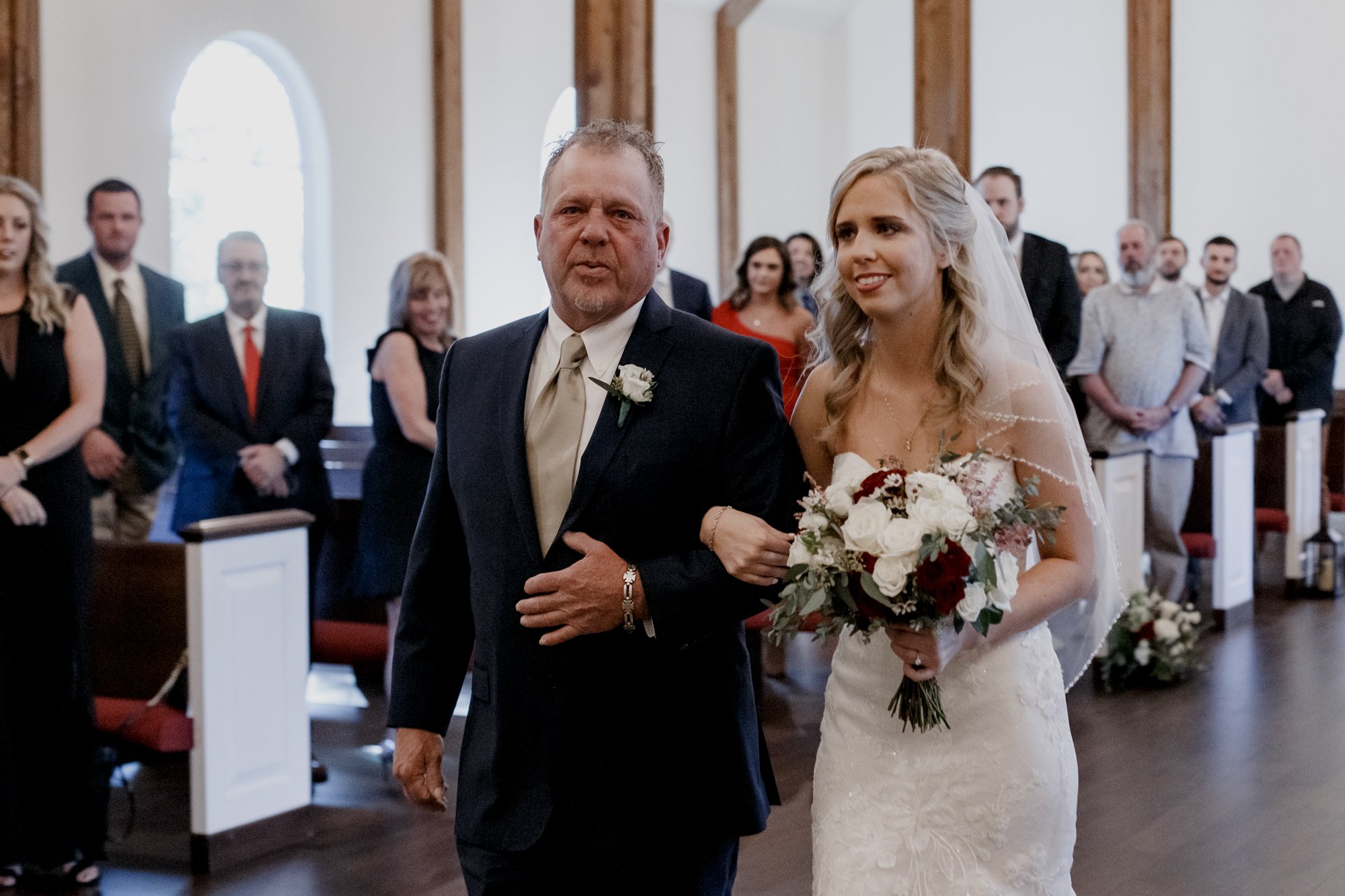 Father and the bride walking down the aisle. Wedding Ceremony at The Vine (New Ulm, TX)
