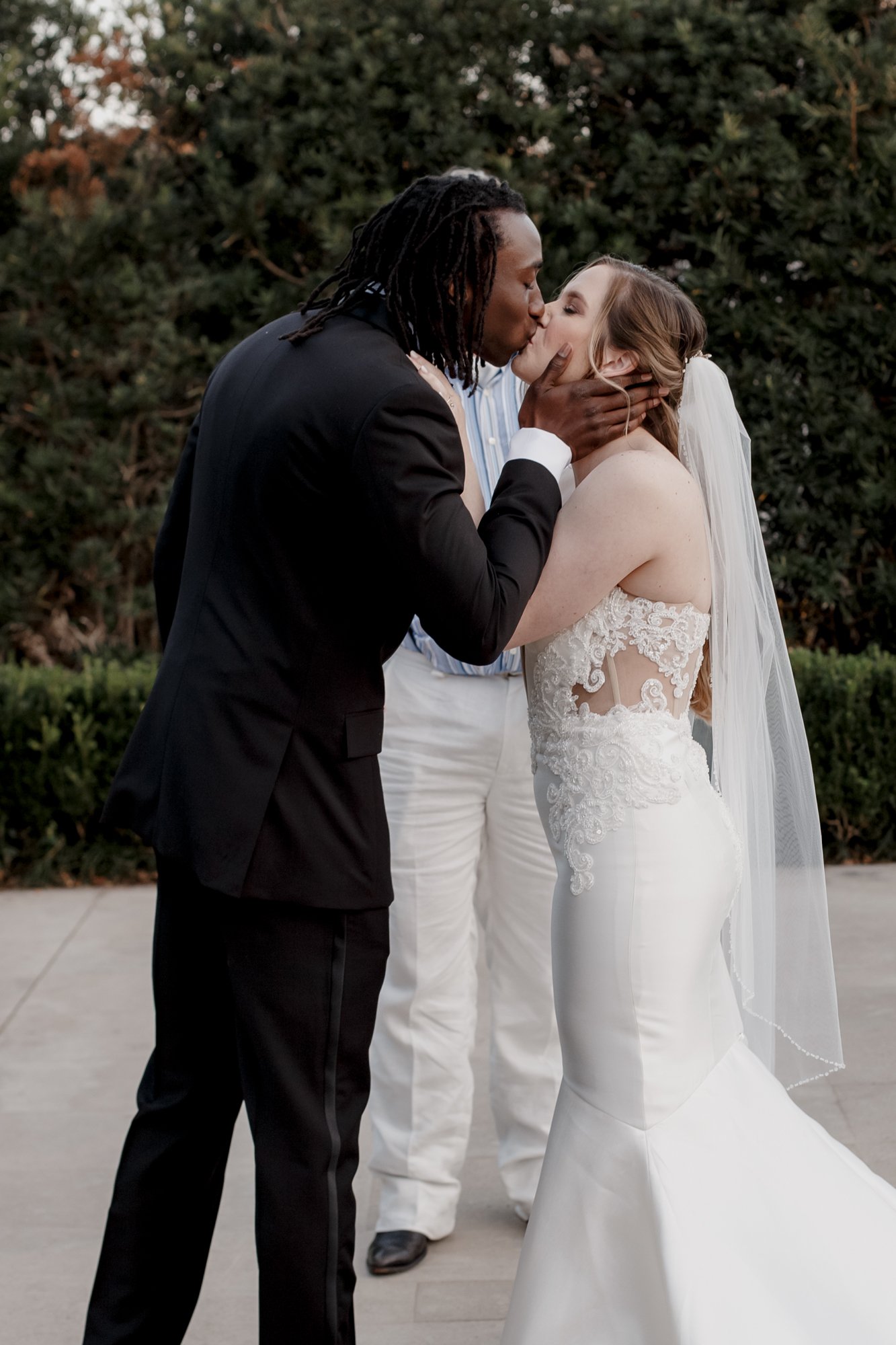 Bride and groom first kiss Wedding at McGovern Centennial Gardens