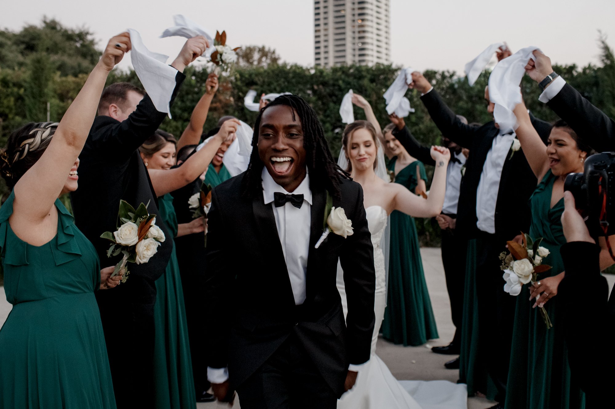 Bride and groom having fun with bridal party. New Orleans Style Wedding at McGovern Centennial Gardens