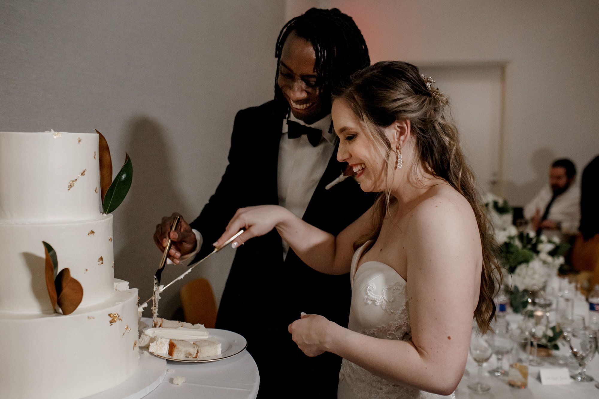 Bride and groom cutting the cake. New Orleans Style Wedding at McGovern Centennial Gardens