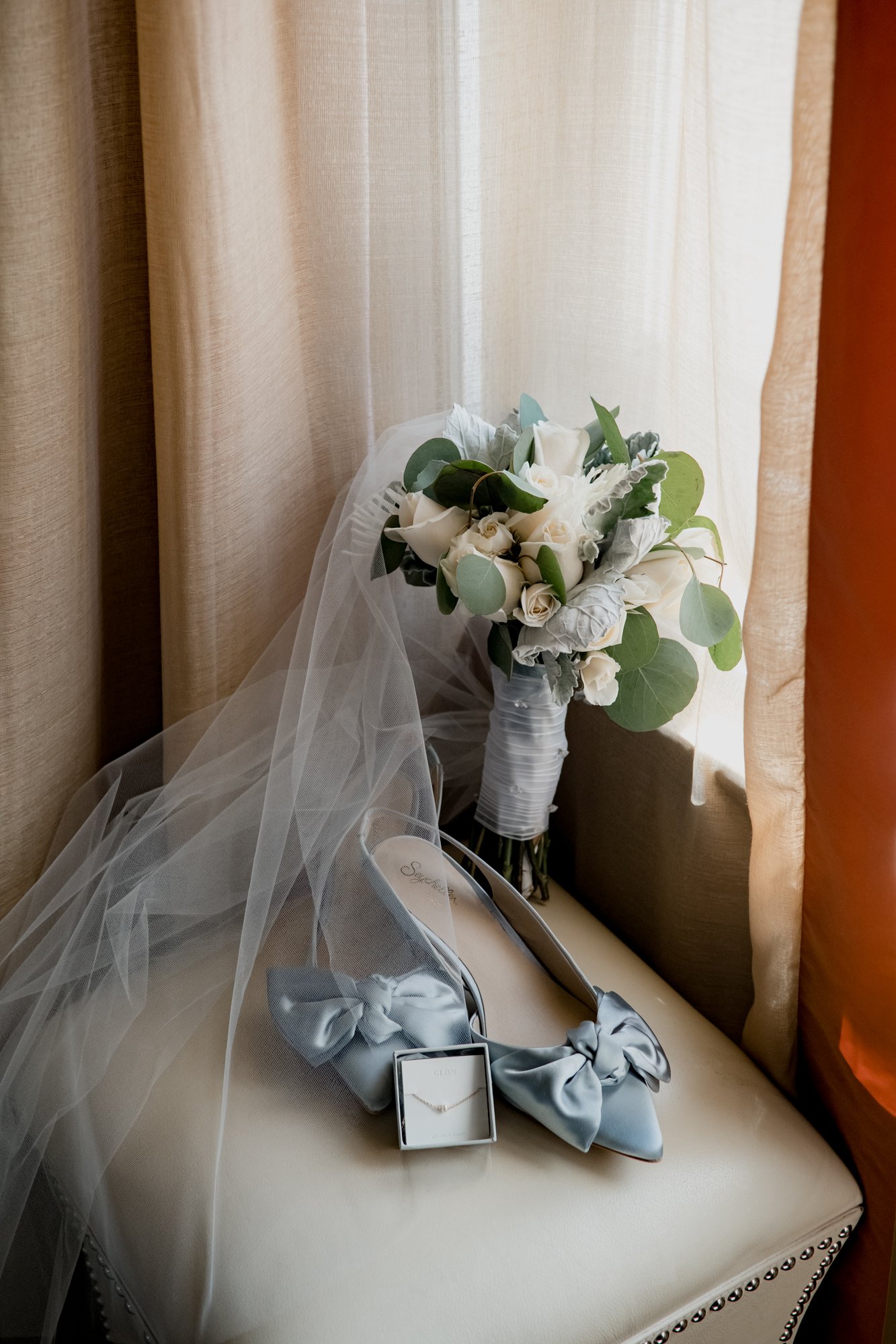 Bridal preparations, bride getting ready, shoes veil bouquet details. Wedding at Hotel Icon