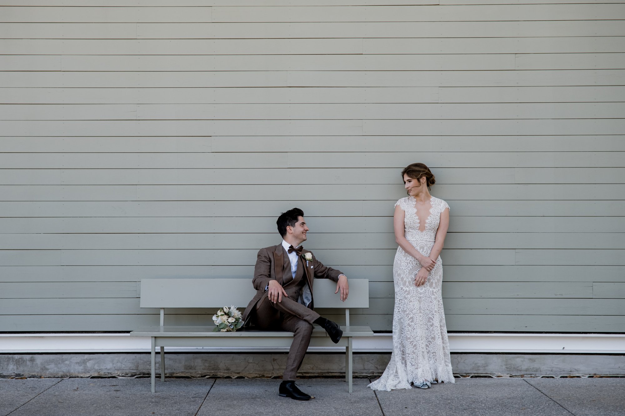 Wedding bride and groom couples portraits on a bench at  Menil Park