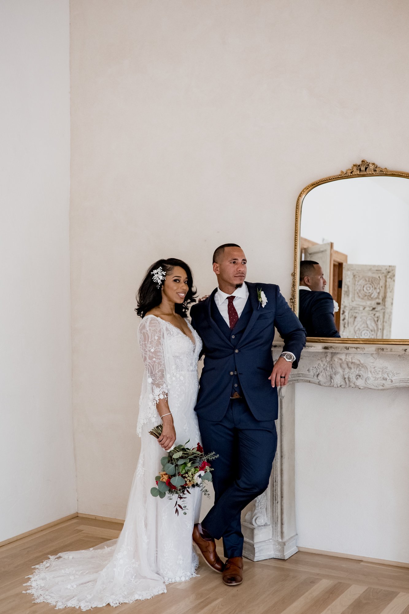 Bride and groom posing by the mirror. Wedding at The Oak Atelier