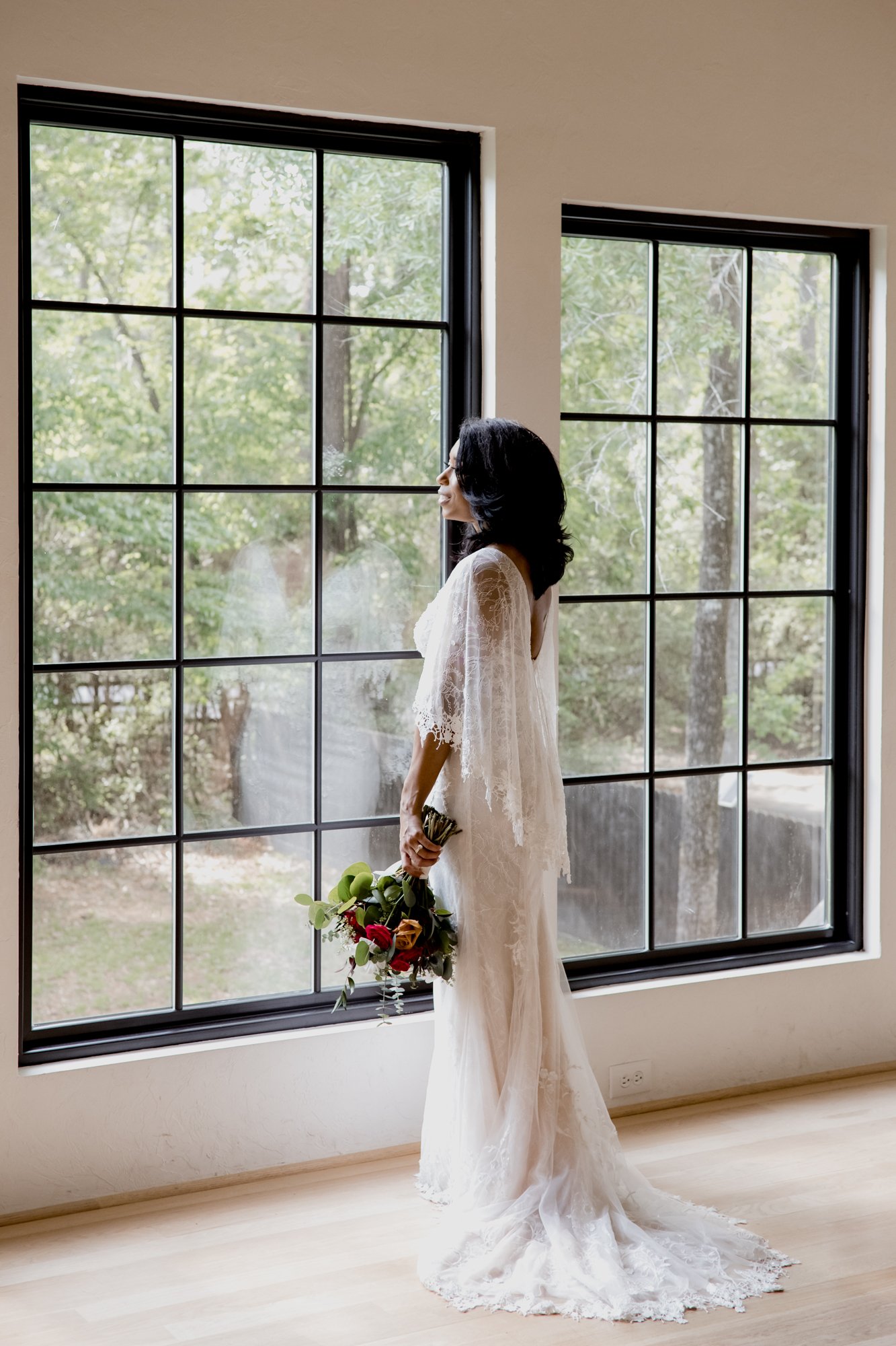 Bridal portraits in front of the window posed. Wedding at The Oak Atelier