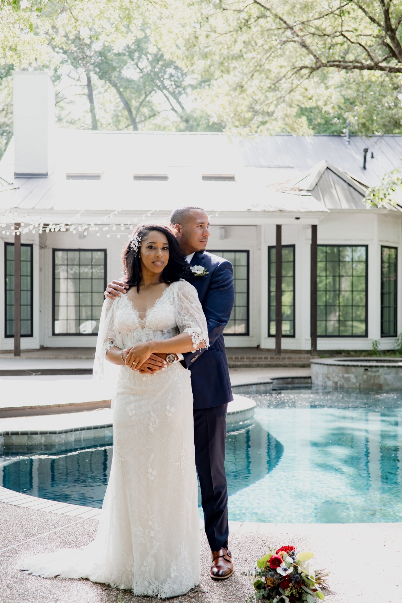 Bride and groom posing by the pool. Wedding at The Oak Atelier
