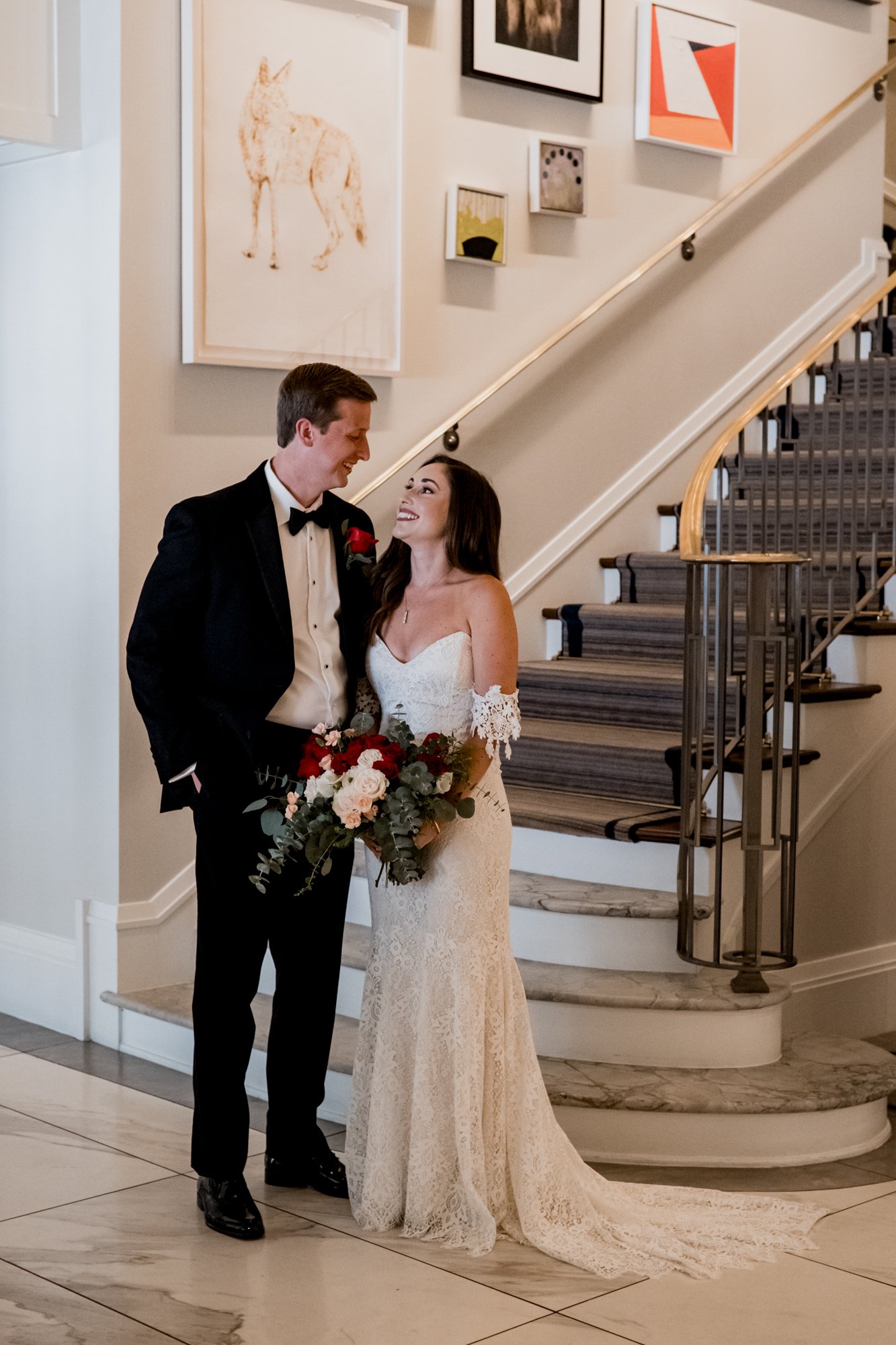 Bride and groom portrait by the staircase at Lancaster Hotel