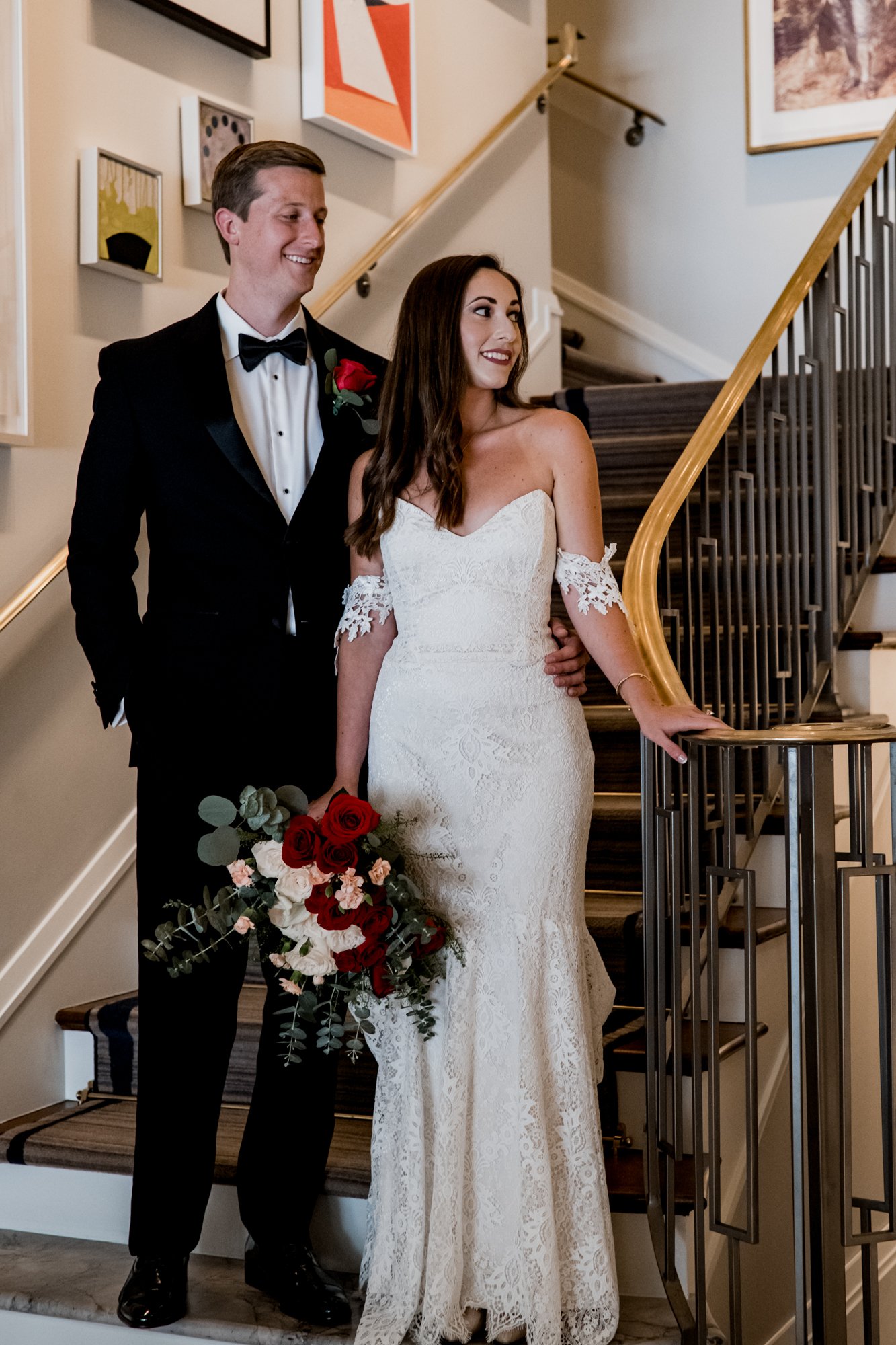 Couples portraits bride and groom by the staircase at Lancaster Hotel
