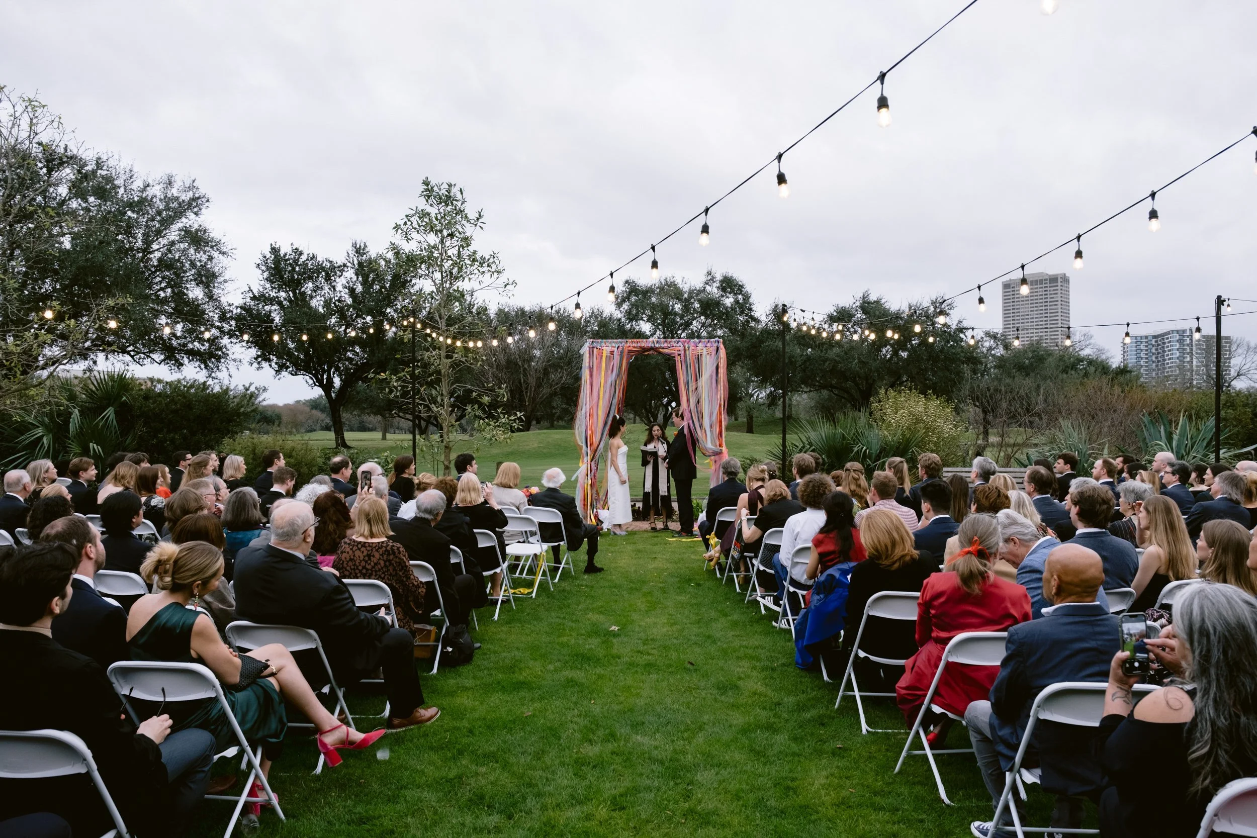 Colorful wedding ceremony at Lott Hall in Hermann Park