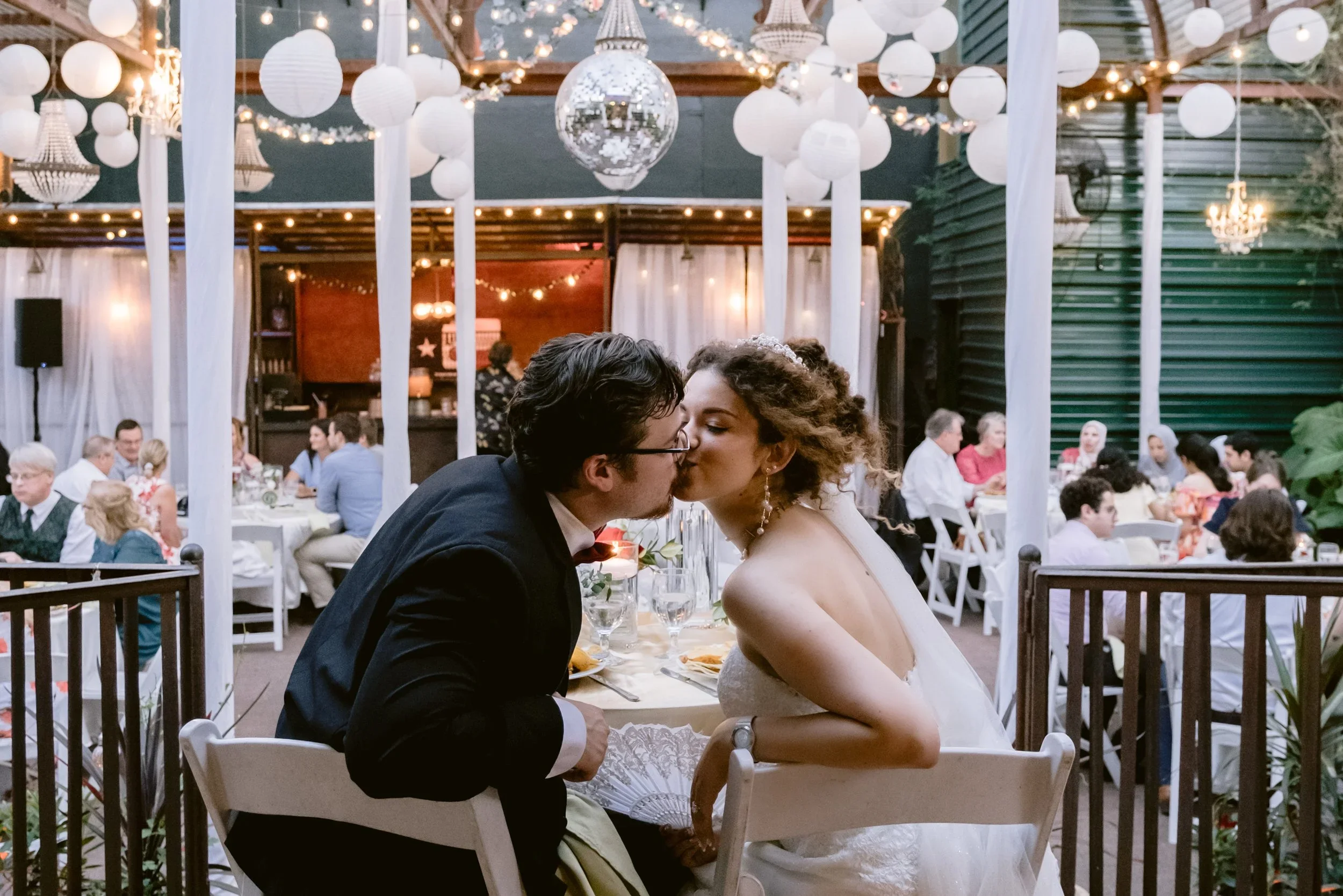 bride and groom sharing a quick kiss when you think nobody is looking