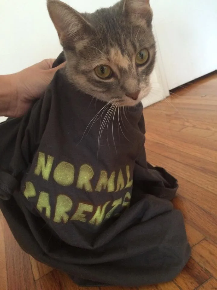 Karen gets cozy on the flo with her Normal Parents