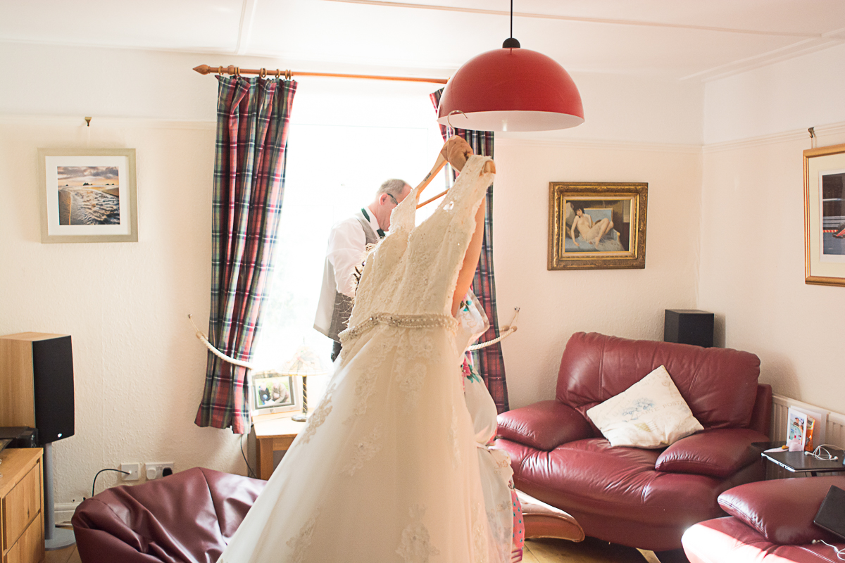 bride carrying dress in truro cornwall