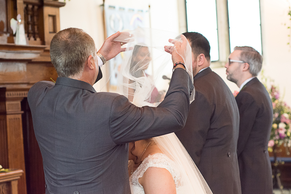dad lifts his daughters veil at porthleven church