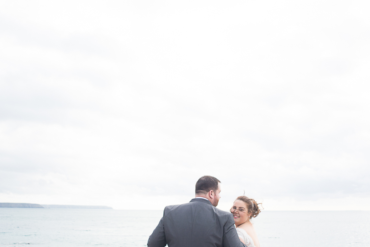 bride and groom on porthleven peir