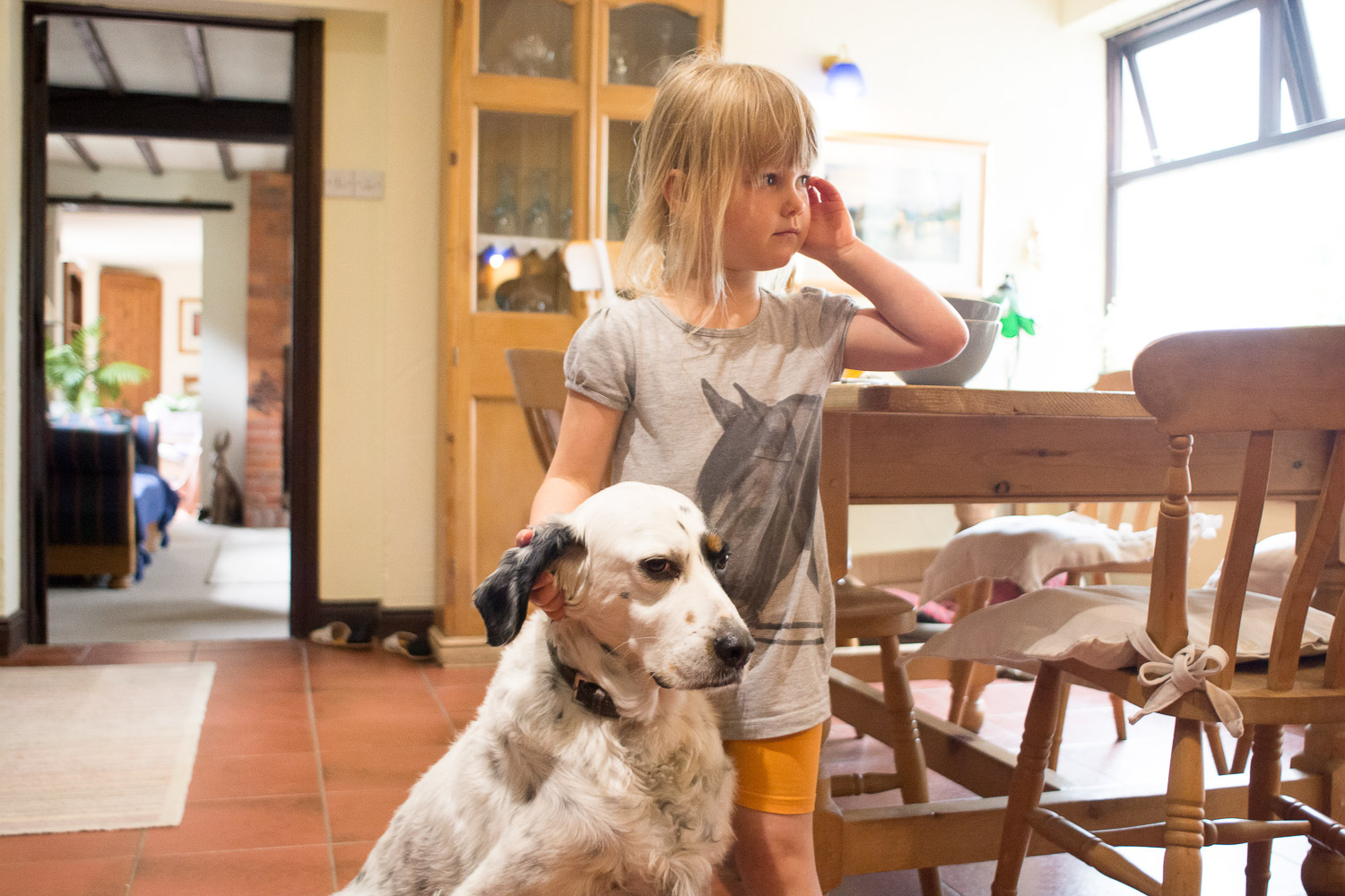 little girl and dog in the cottage at wedding yurts wedding in leicestershire