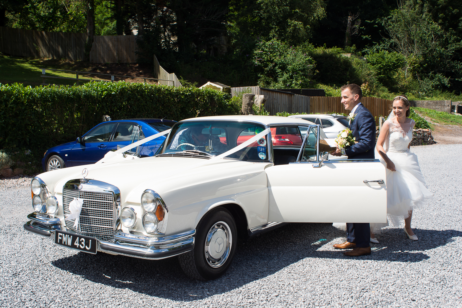 Bride and Groom arriving in style at the Bickley Mill wedding venue in Devon
