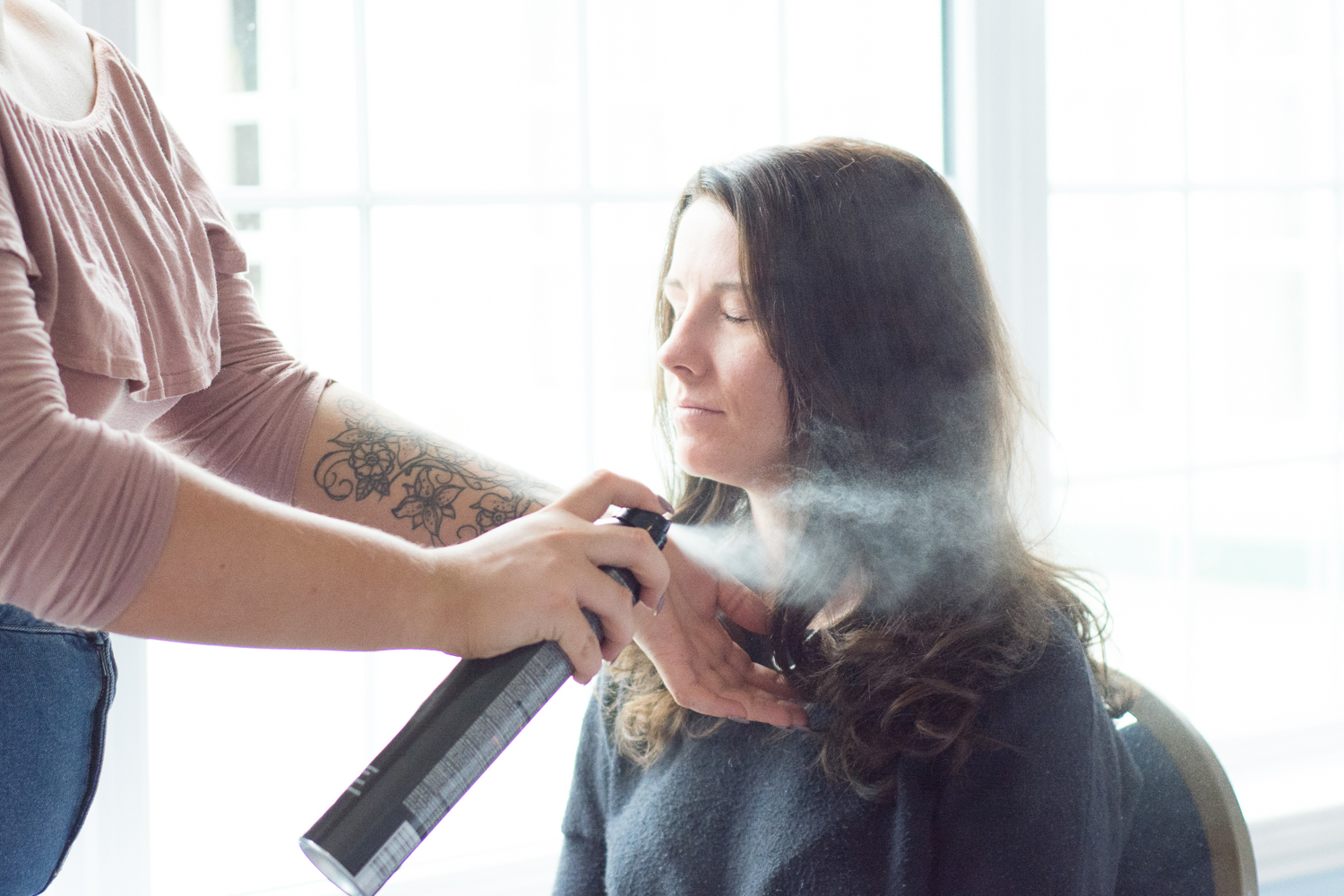 bridesmaid having her hair sprayed at the lord haldon hotel in devon
