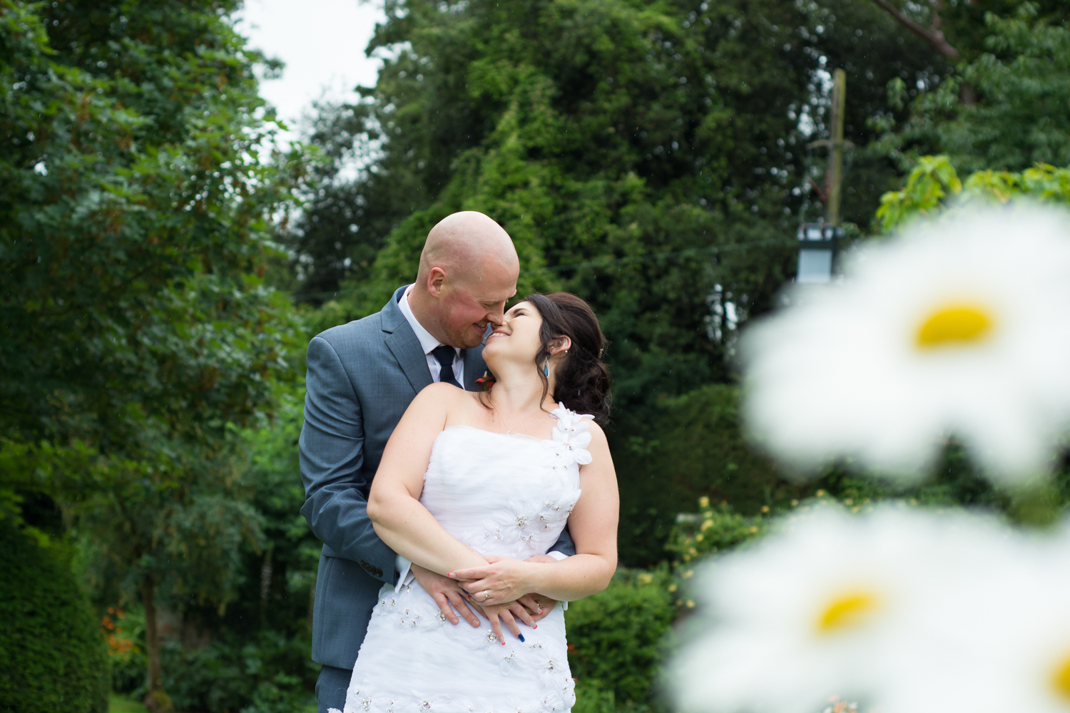 bride, groom and giant daisies at The Lord Haldon Hotel in Devon