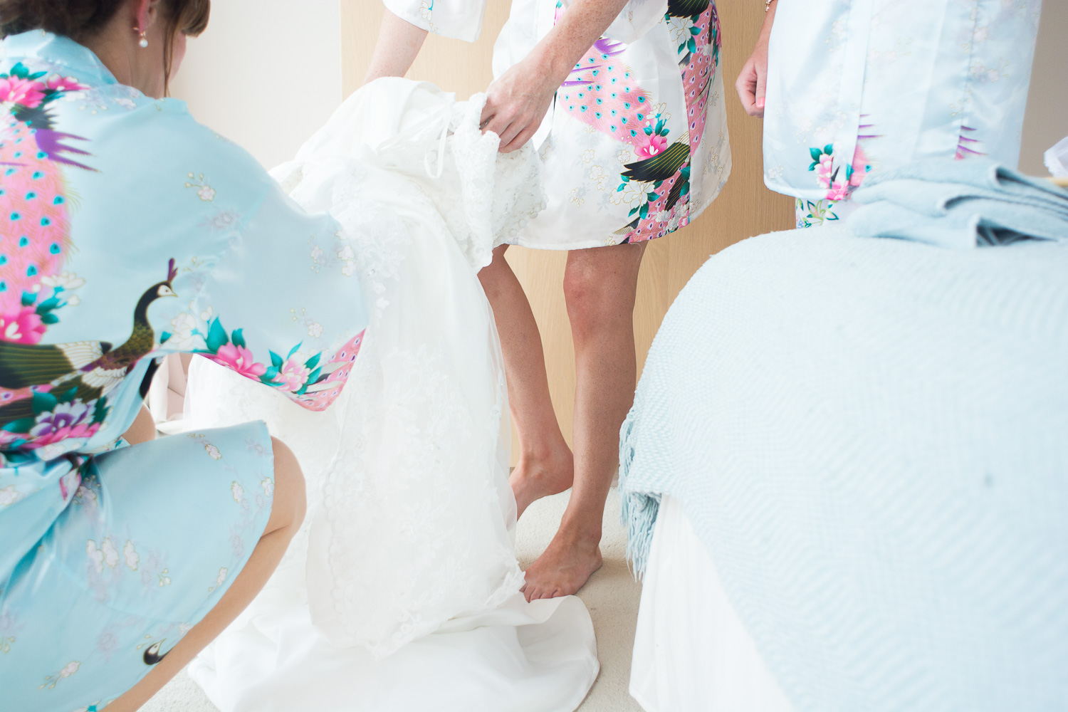 bride steps into dress in woolacombe, devon