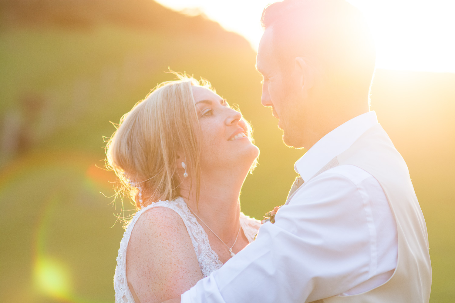 bride and groom share a moment in the beautiful sunset at their woolacombe festival wedding