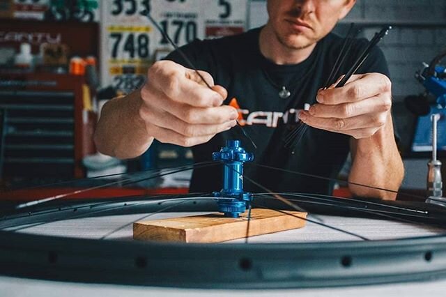 Lacing up a Cantu Rova gravel wheel with a custom blue hub. This is one of the first steps into building a beautiful new set of quality wheels. These wheels can't wait to head north to their owner to explore gravel in Illinois.  #handbuilt