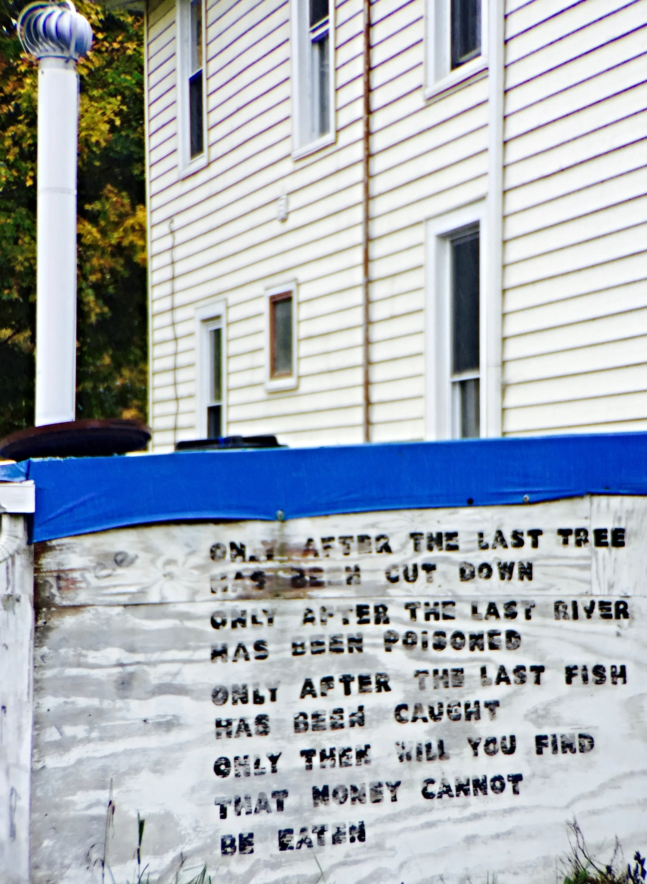 Outside the house was a flare stack with a sign.