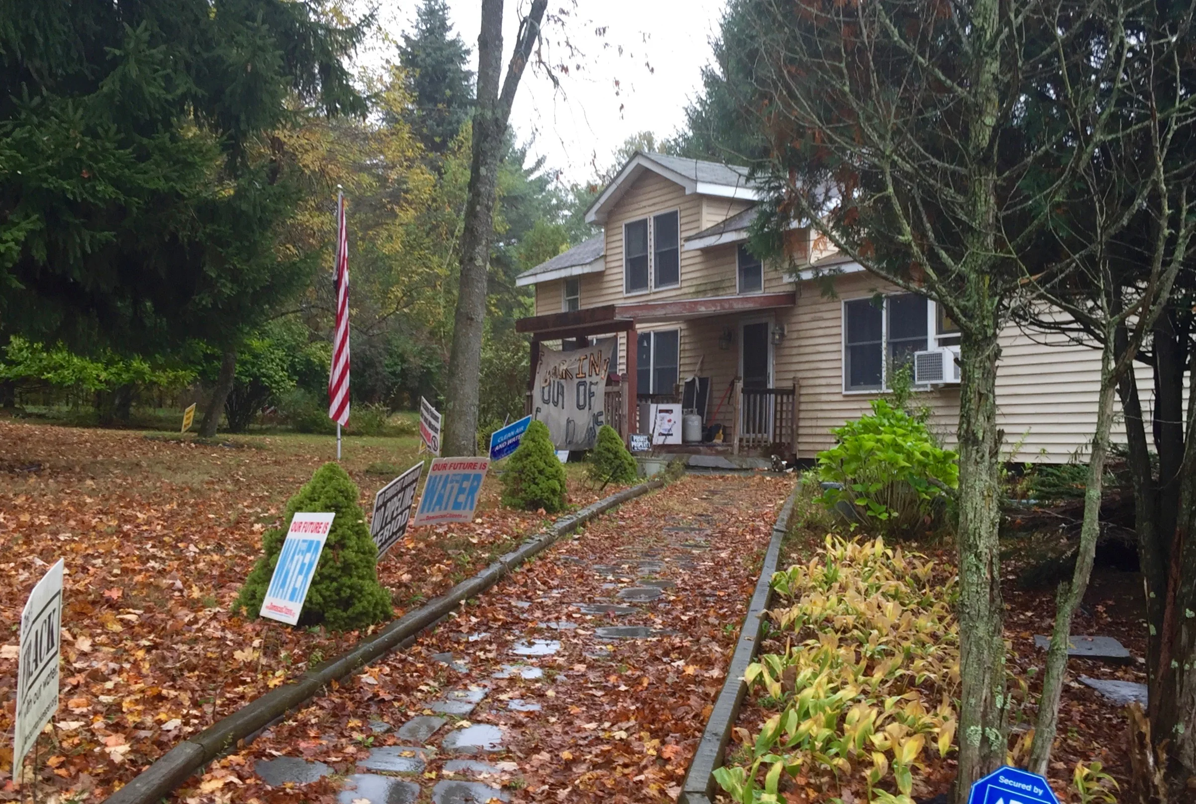 The front of Ray Kimble's home on Carter Road. The signs are all anti-fracking.