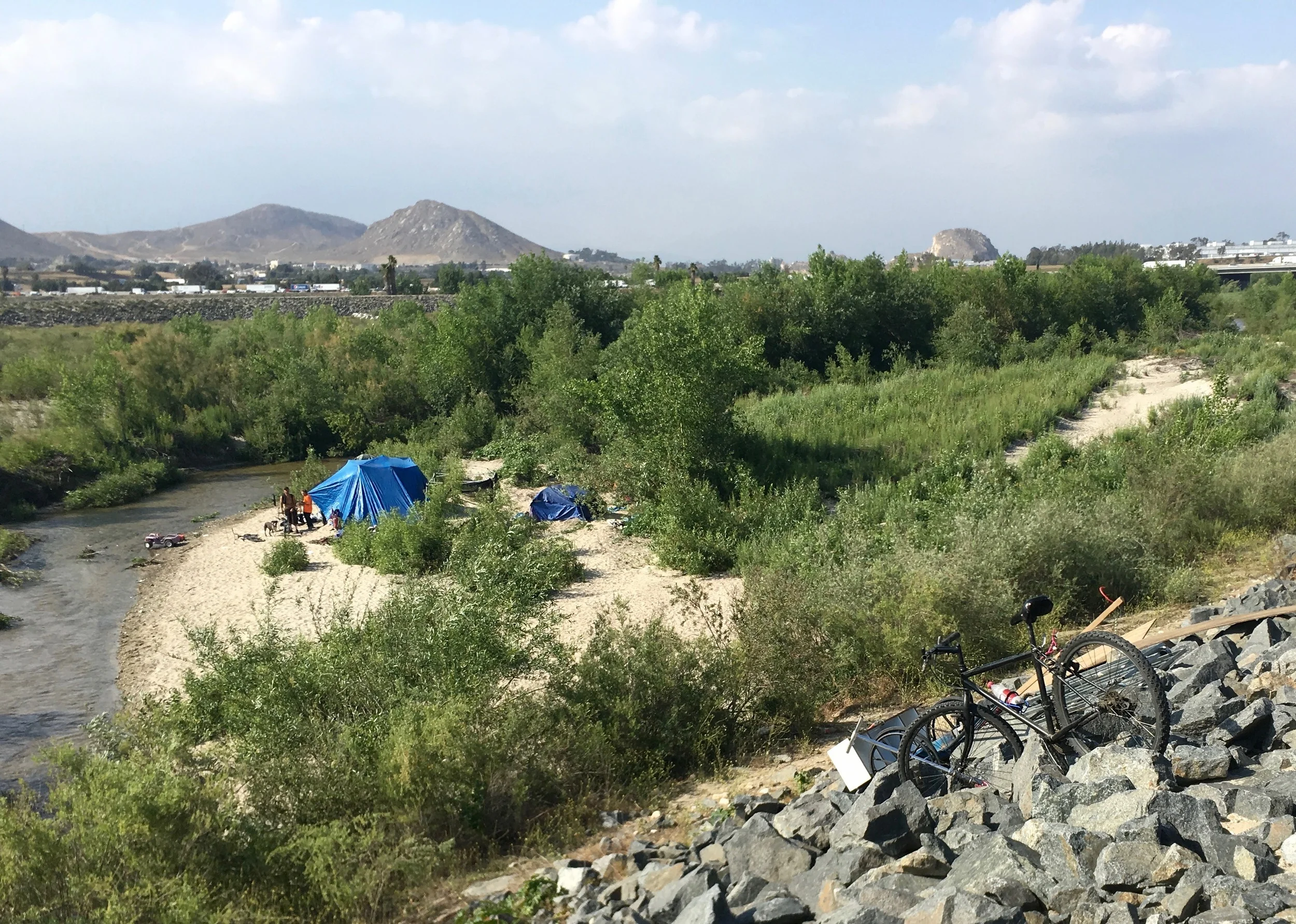 One of many encampments of "homeless" people on the Santa Ana River. I wonder if we would have regarded folks living similarly as homeless 100 years ago?&nbsp;