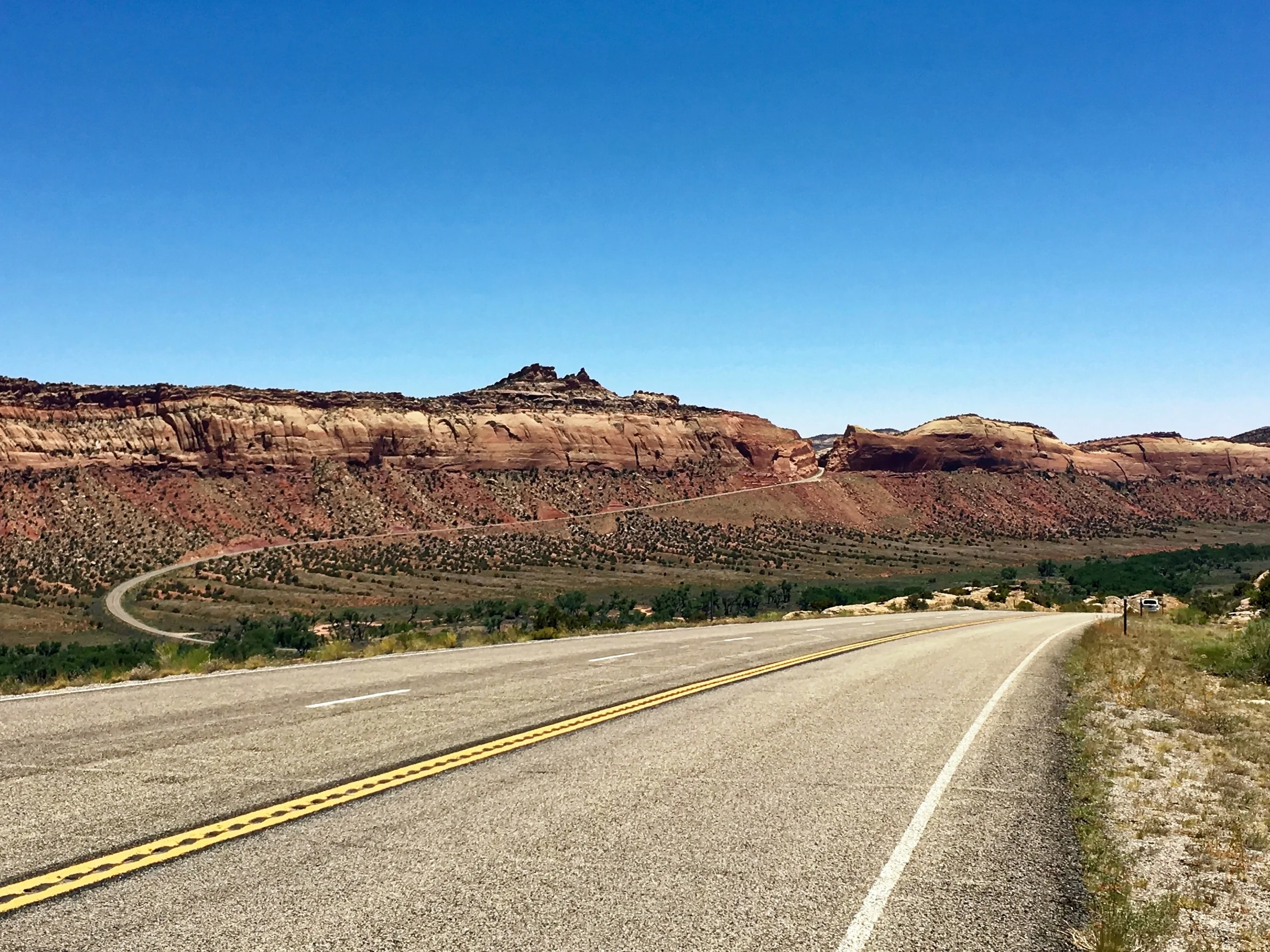 The notch in the ridge is the road. It went down and then up, up, up at an 8% grade. I walked the bike.&nbsp;