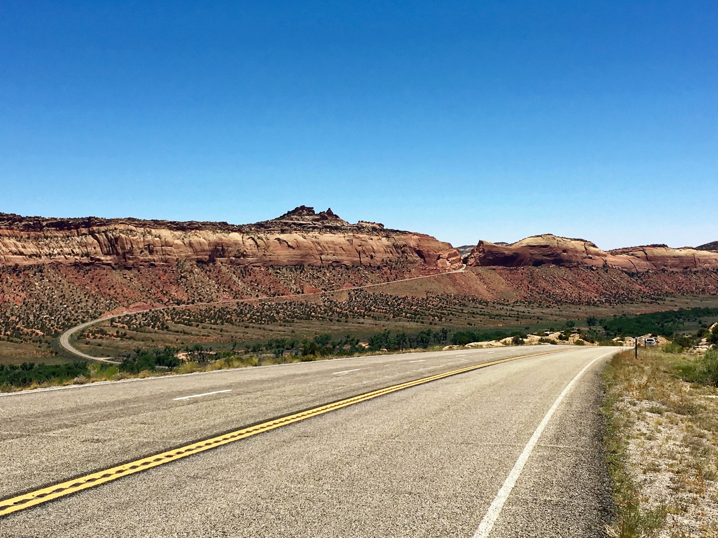 The notch in the ridge is the road. It went down and then up, up, up at an 8% grade. I walked the bike. 