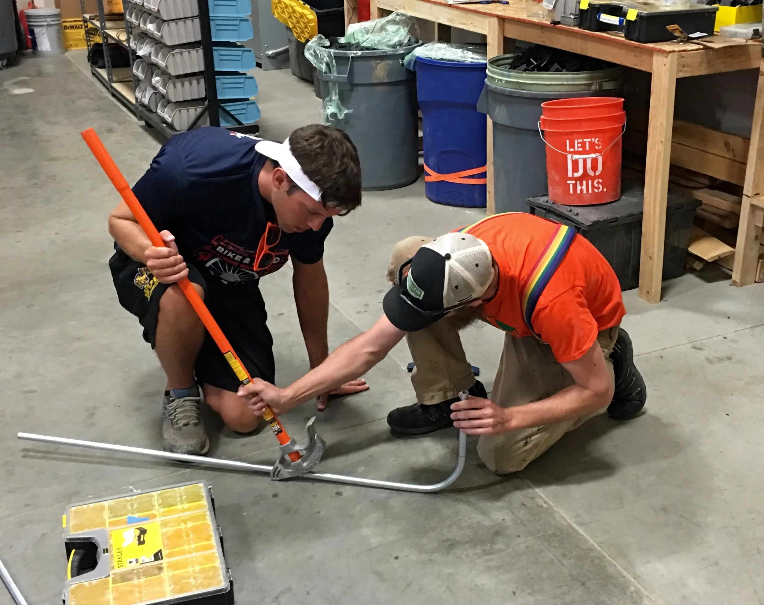 A workshop in conduit bending for the "Bike and Build" crew at GRID, Colorado.