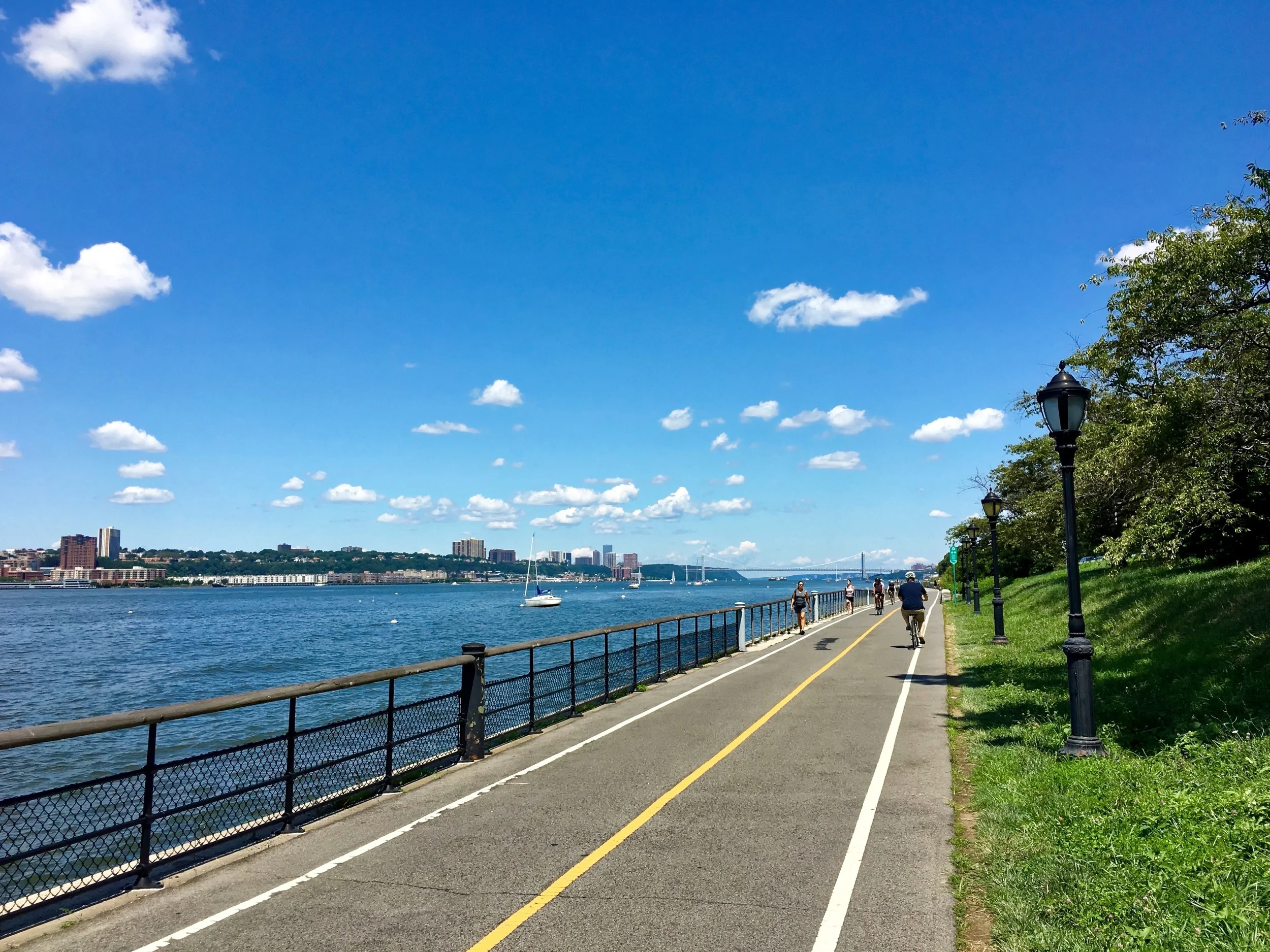 The NYC West Side Bike Path that runs north and south along the Hudson River. The bridge in the distance is the George Washington. I took this shot as I biked north to my apartment in Washington Heights on the day I returned.&nbsp;