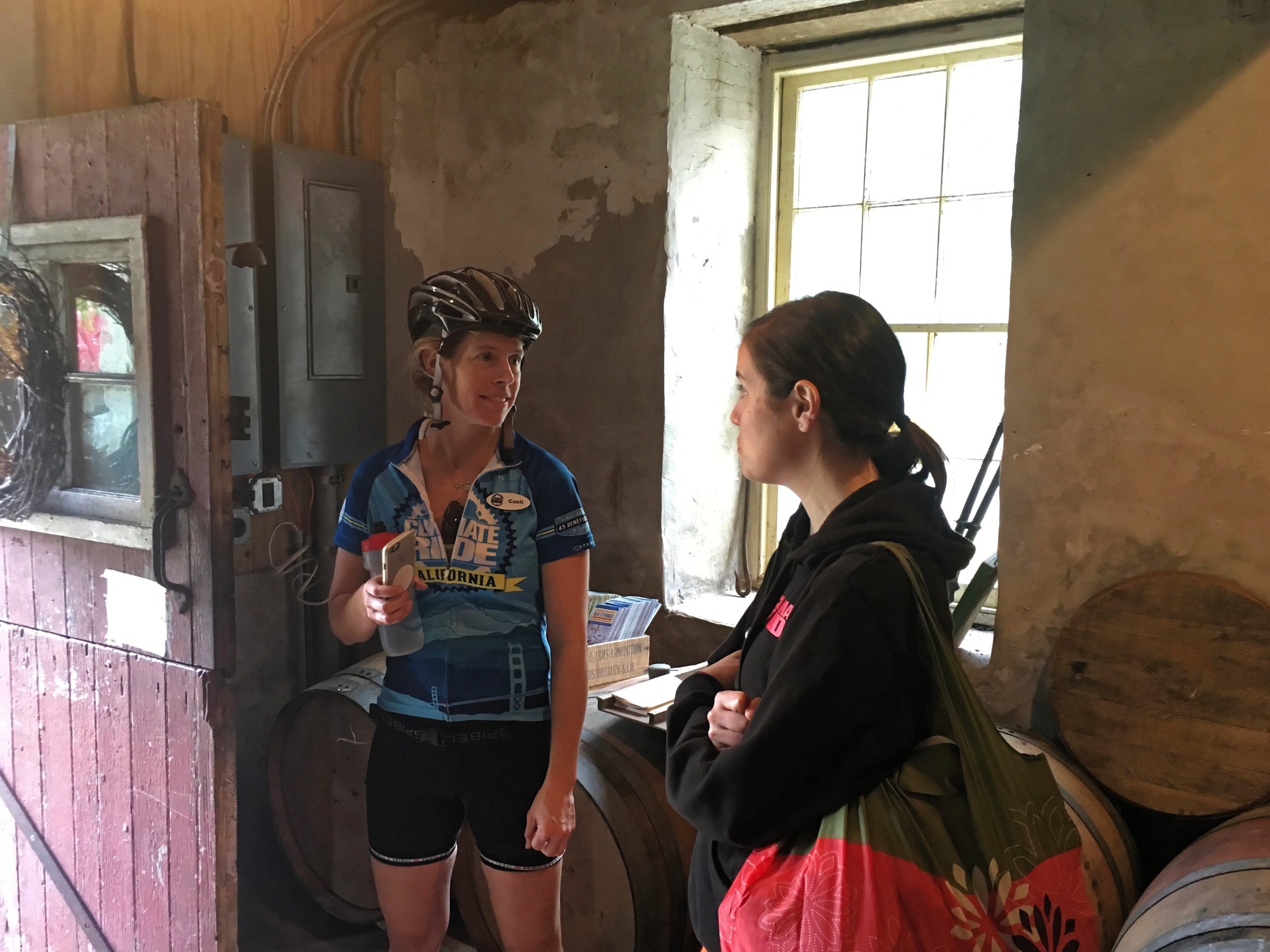 Caeli from Climate Ride talking to a rider