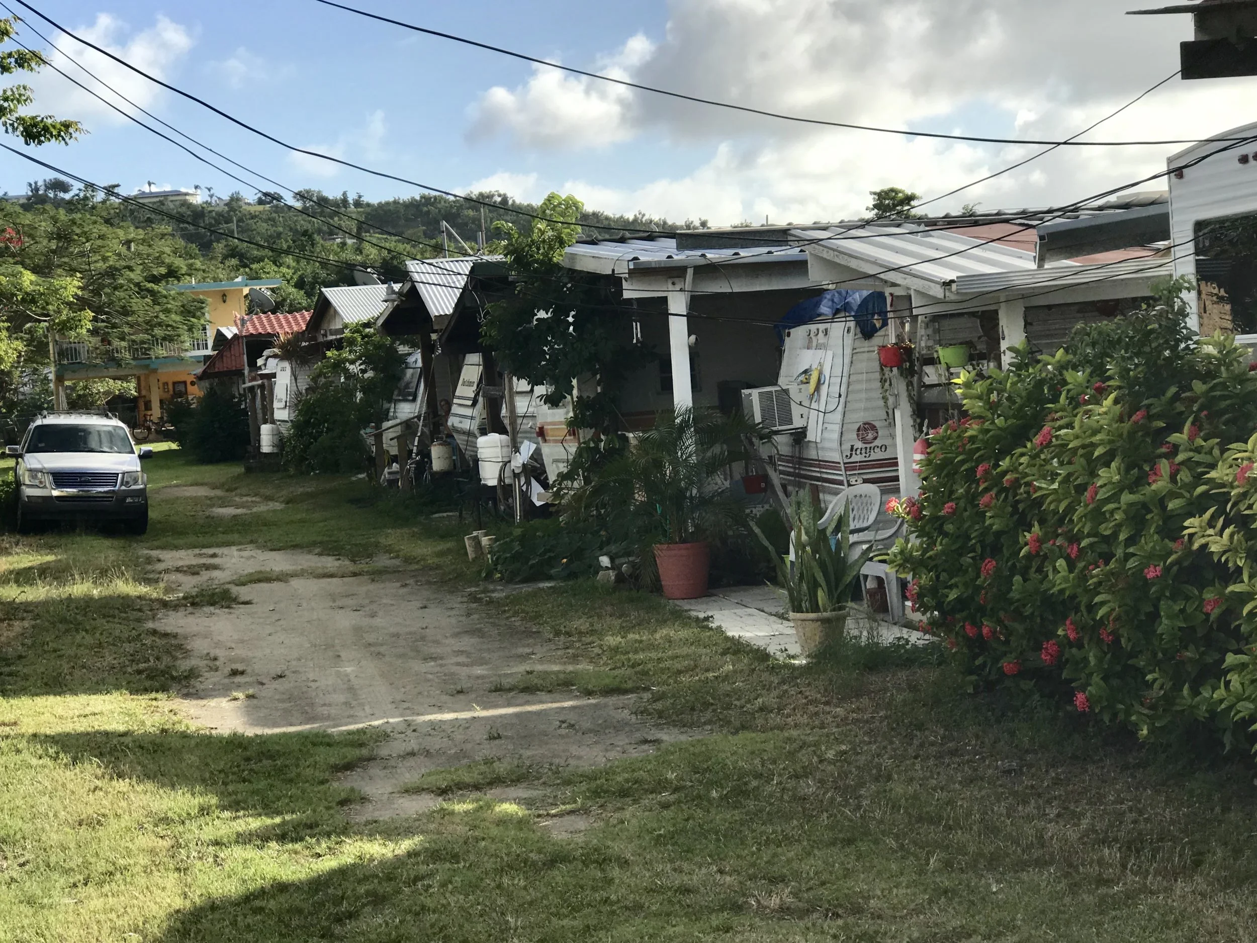 This neighborhood is across the street from the beach, and looked unscathed. I asked a resident if he had been there during the storm. He said no, but added that he was pleased when he came home to find things ok. Apparently his neighbors in an adjo…