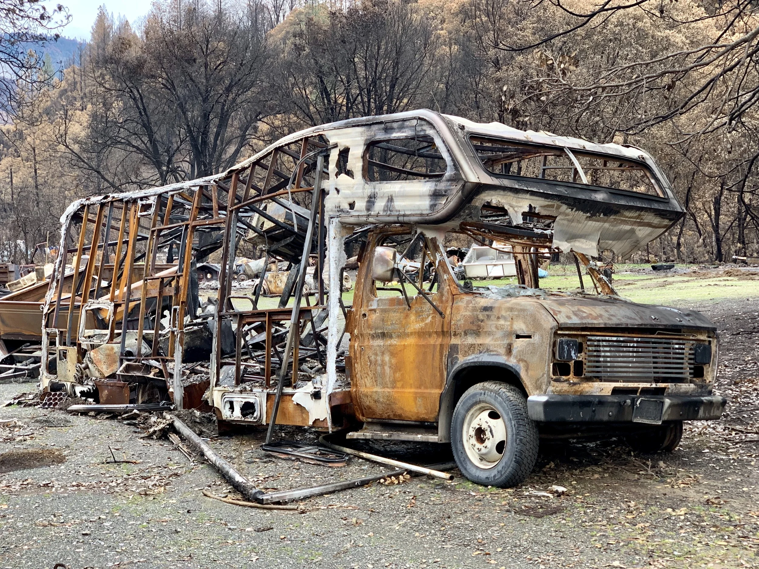 A large burnt out camper van sits by a highway near Delta, Ca. The Woolsey and the Delta fires took place in September and November, 2018, respectively.