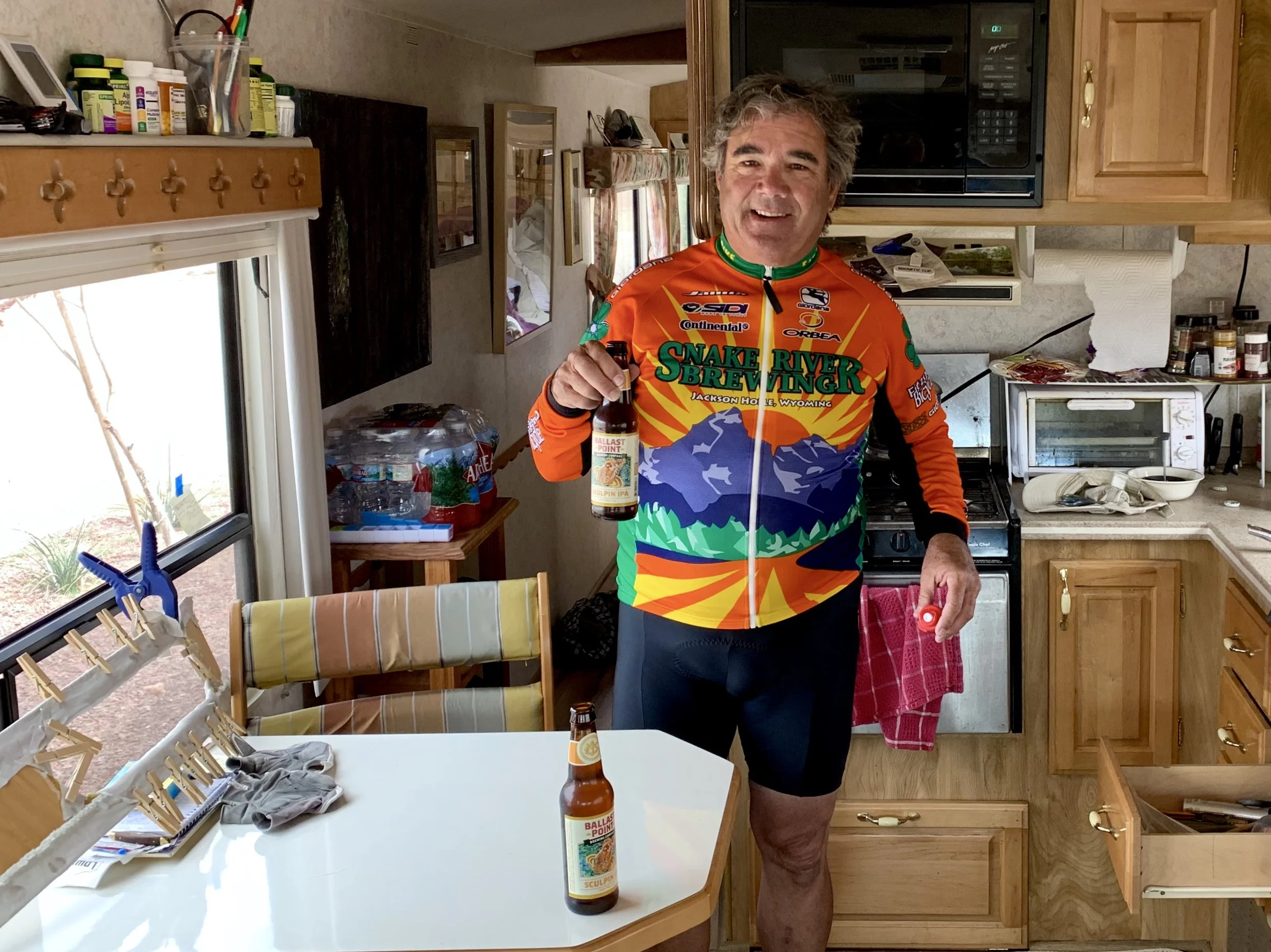 Dave in his RV offering me a beer after a very windy ride.