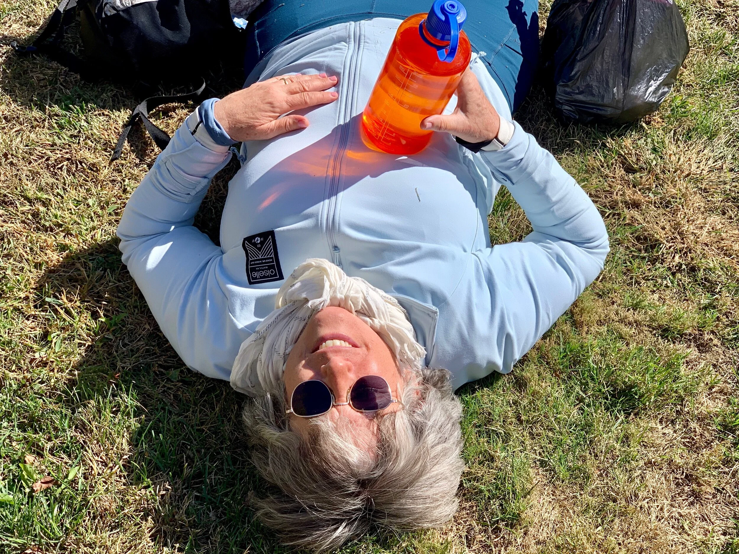 A tired cyclist rests after lunch.
