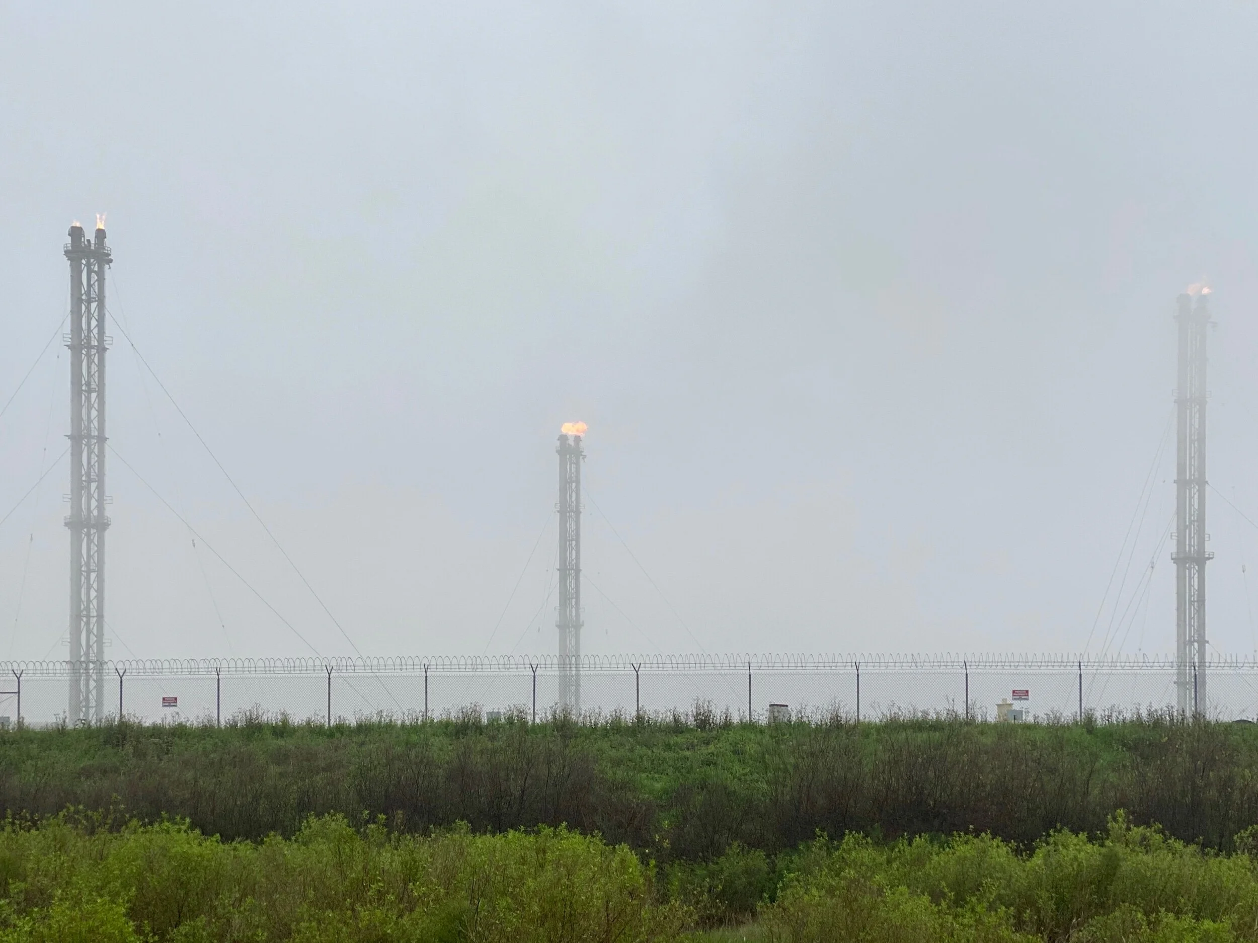 Gas flares in the marsh about a mile from the Liousiana Coast.