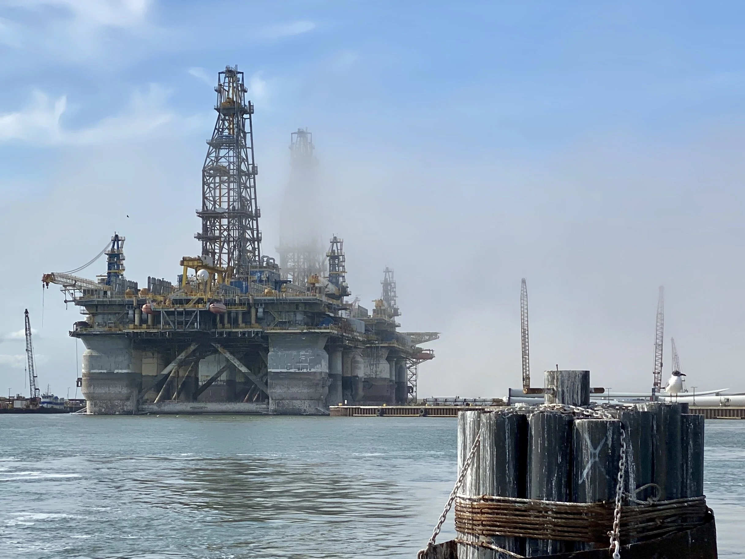 Temporary oil derricks next to the Corpus Christi shipping channel. The local community was told they would be there for six months, but are still there after almost 3 years. And it’s a big bone of contention in this community. Picture taken from th…
