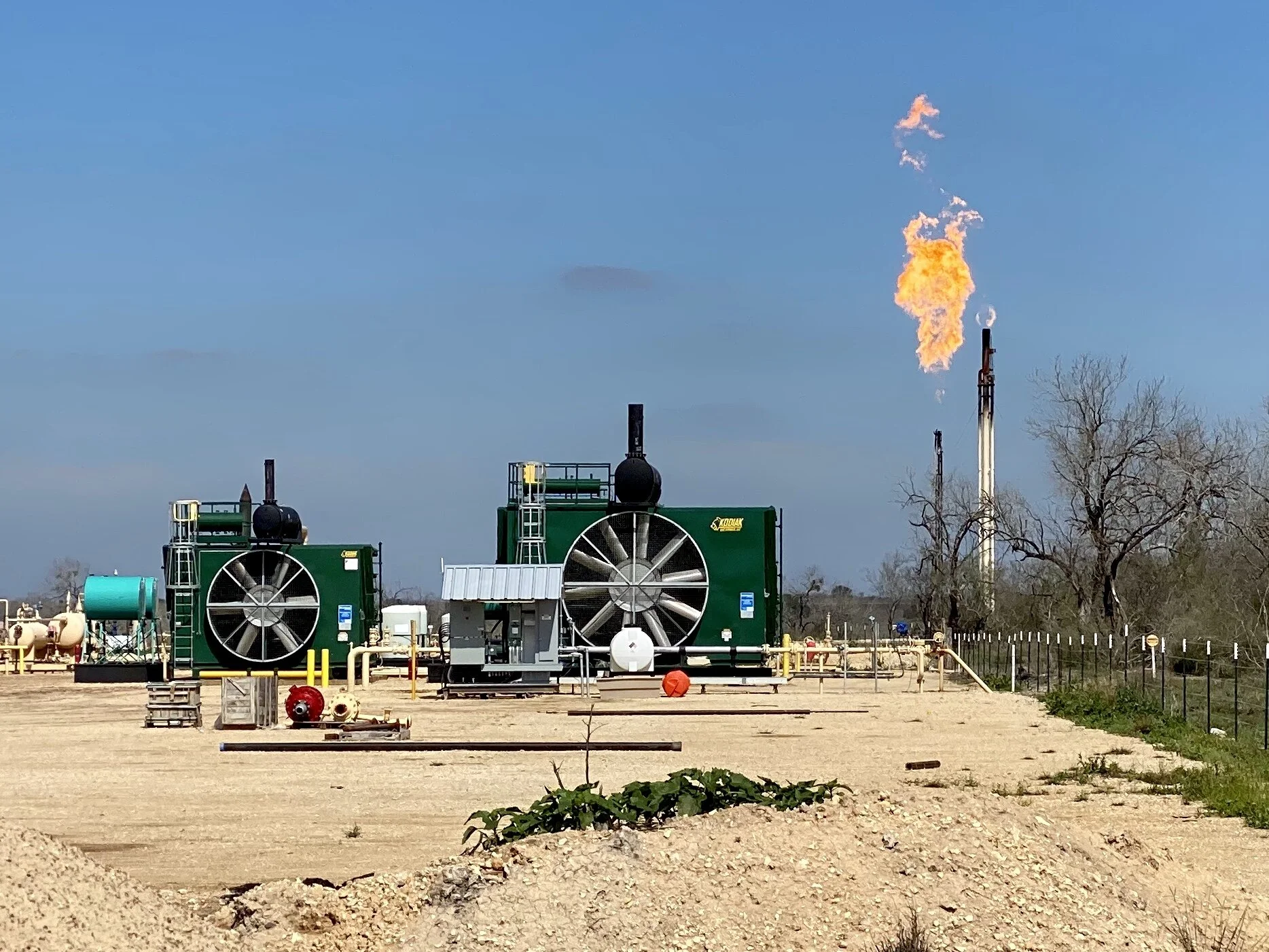 A hydrogen sulfide (H2S) flare near a gas pad. Flaring burns off gas that is deemed uneconomical to collect and sell. It is common to flare natural gas that contains hydrogen sulfide to convert the highly toxic hydrogen sulfide gas into less toxic c…