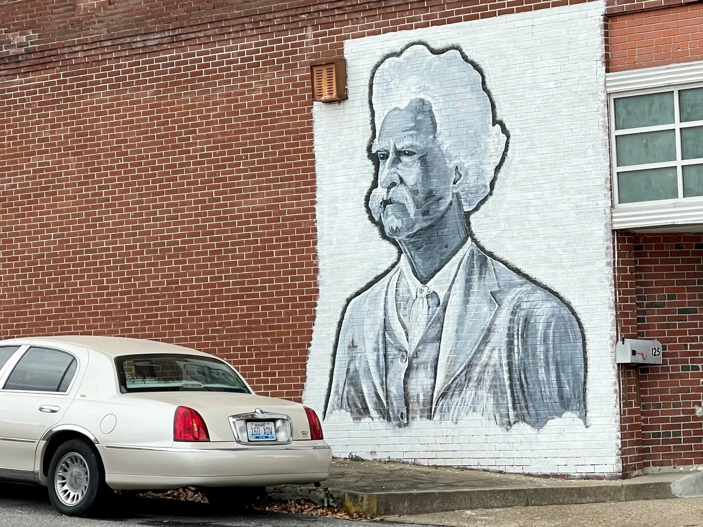 A Mark Twain mural on one of the few occupied buildings in downtown Hickman, Kentucky.