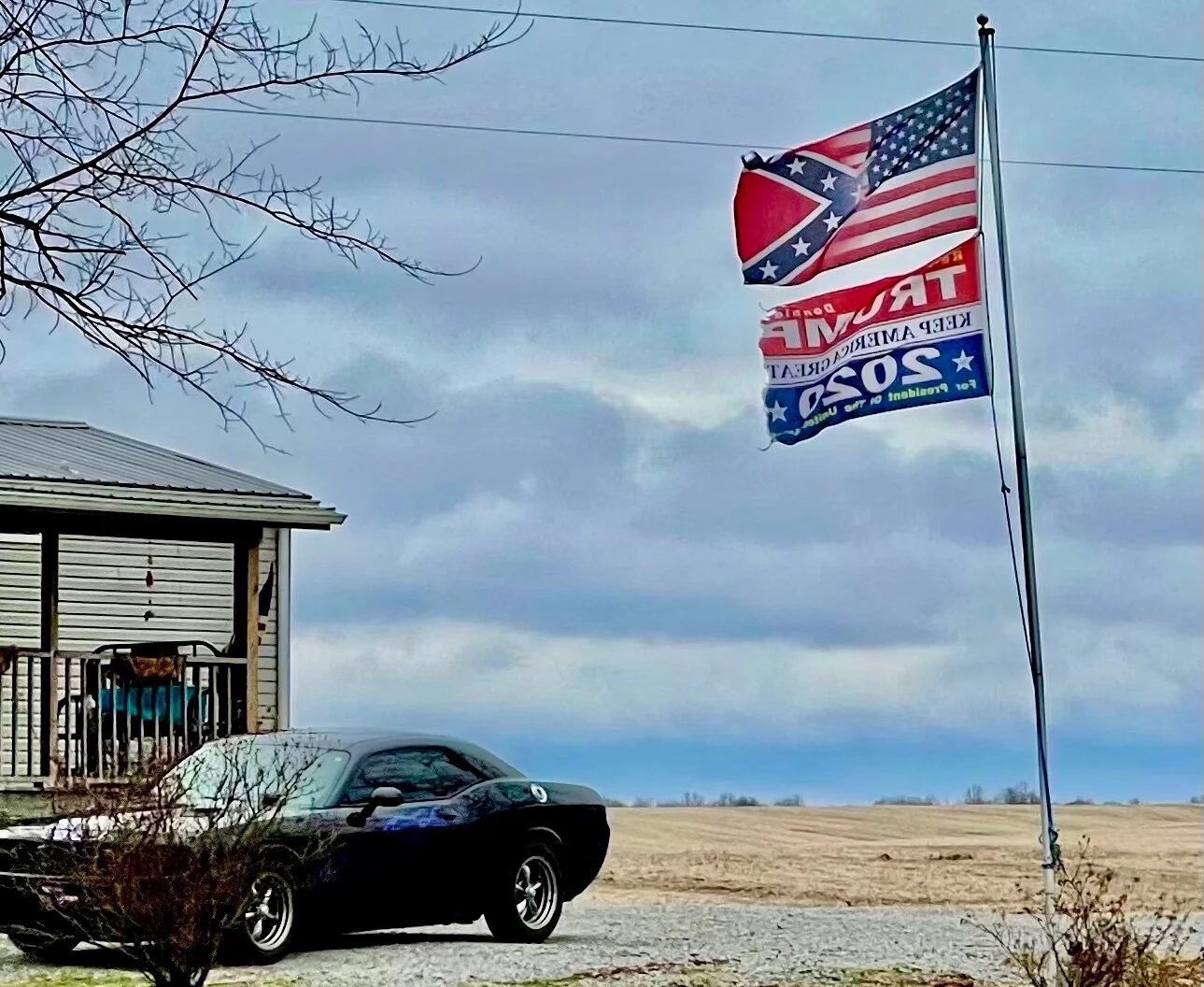 Taken just below Union City, Tennessee. I’ve seen Confederate flags displayed underneath American flags with Trump/Pence signs, but never before an American and Confederate flag blended together.