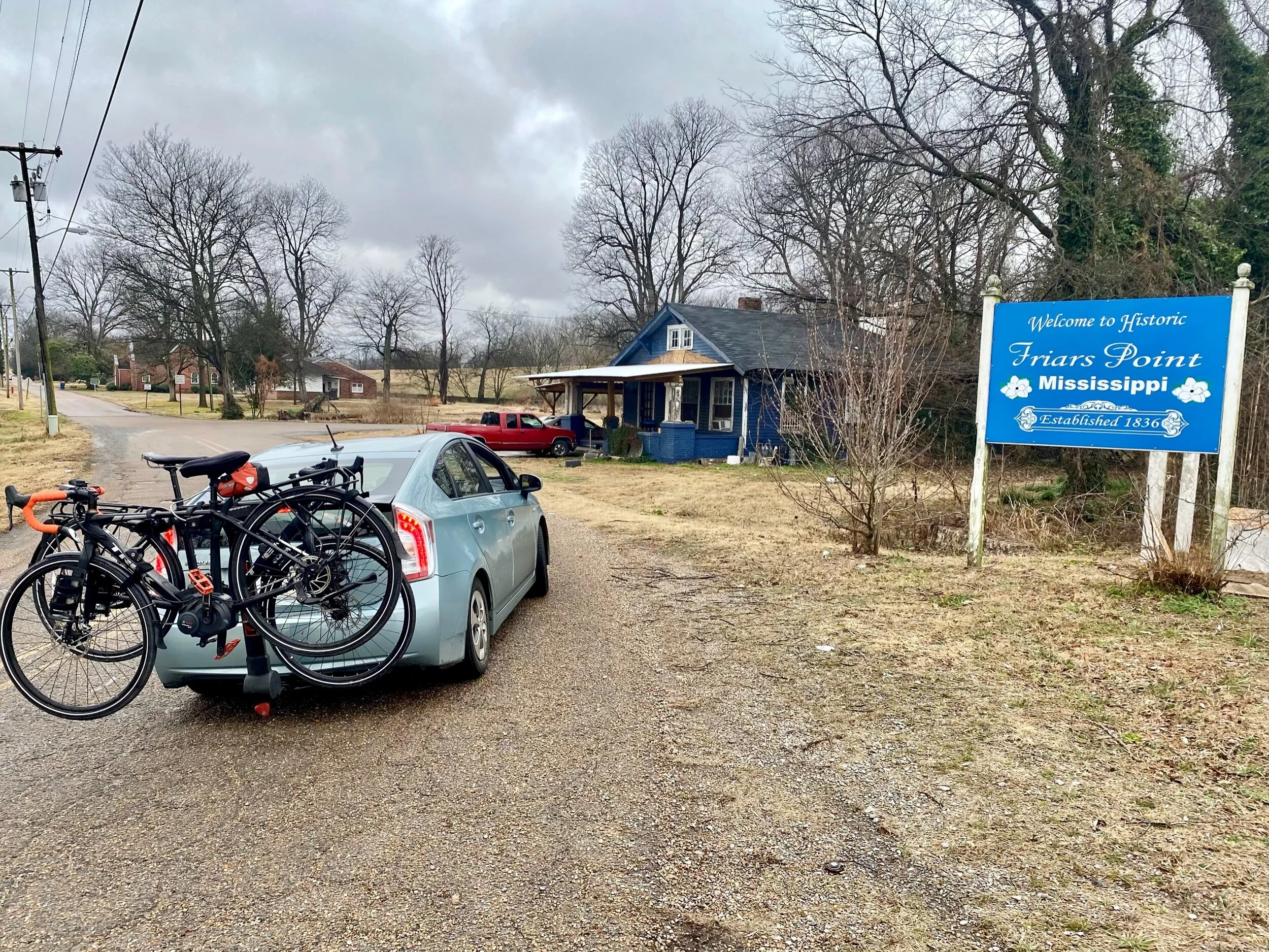 A shot of our rig in Friar’s Point, Mississippi. We haul our food in a car because we chose to minimize our exposure to Covid by not eating in restaurants. Our conversations with locals usually take place outside when we are riding our bikes. We dri…