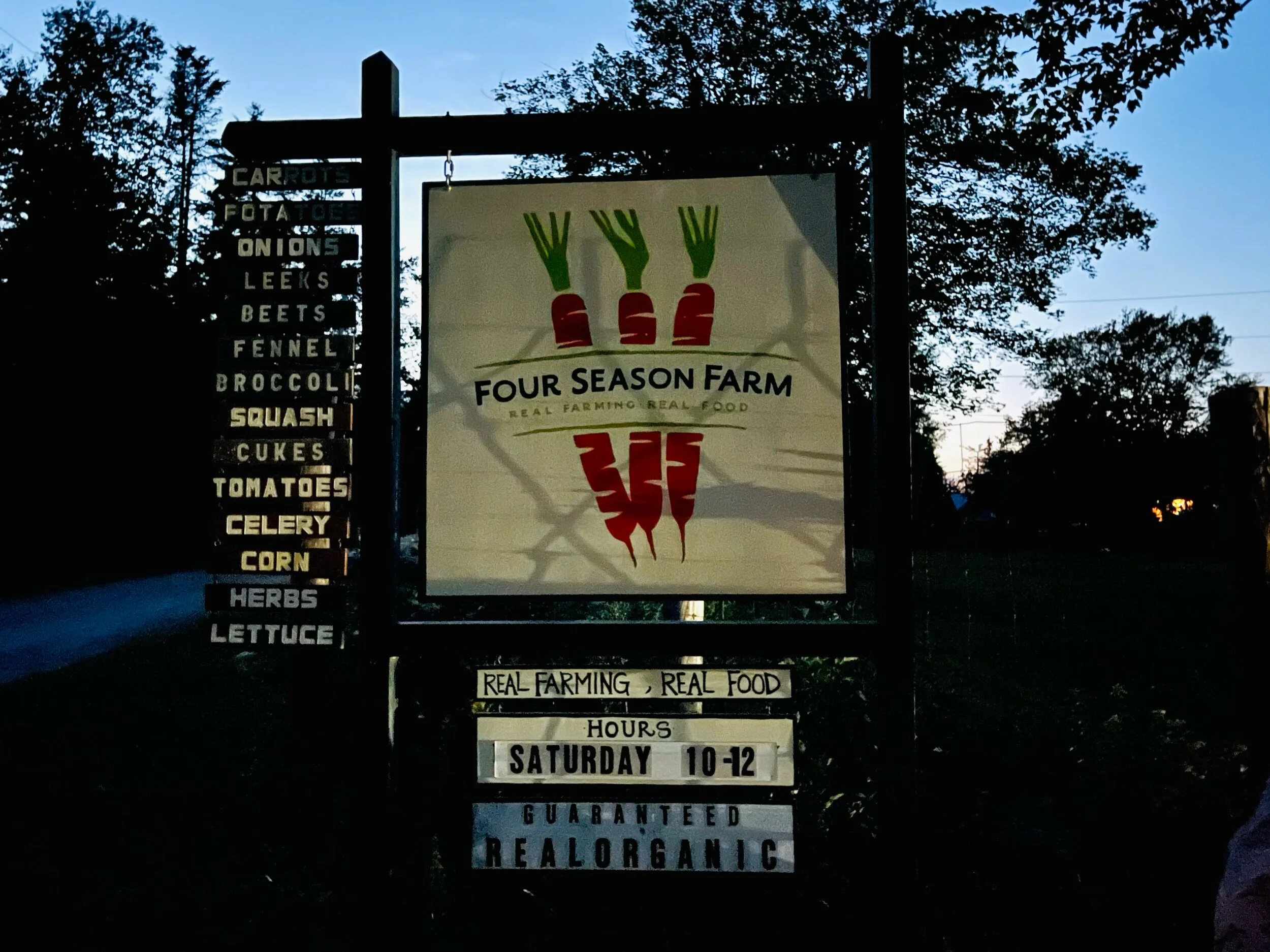 The sun sets behind the sign that identifies the road to Four Season Farm in Harborside, Maine, where Eliot and Barbara live. The farm is currently managed by Eliot’s daughter Clara Coleman. Photo by Michael Chase. Follow him on Instagram @mjohnsonchase.