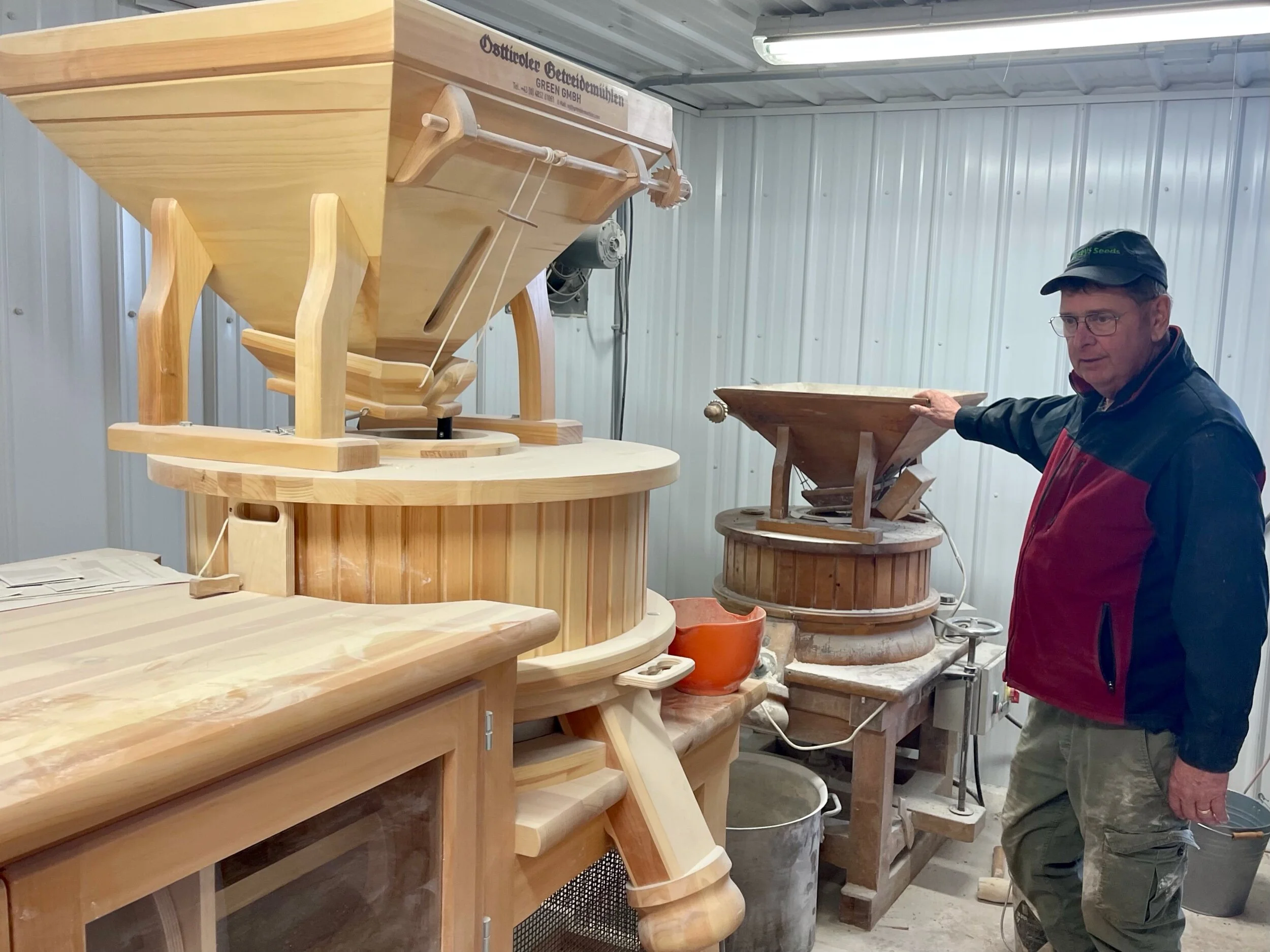 Brian MacCay explains how the multiple grinding and sifting options work on his new flour mill from Austria. Photo by Michael Chase. Follow him on Instagram @mjohnsonchase.