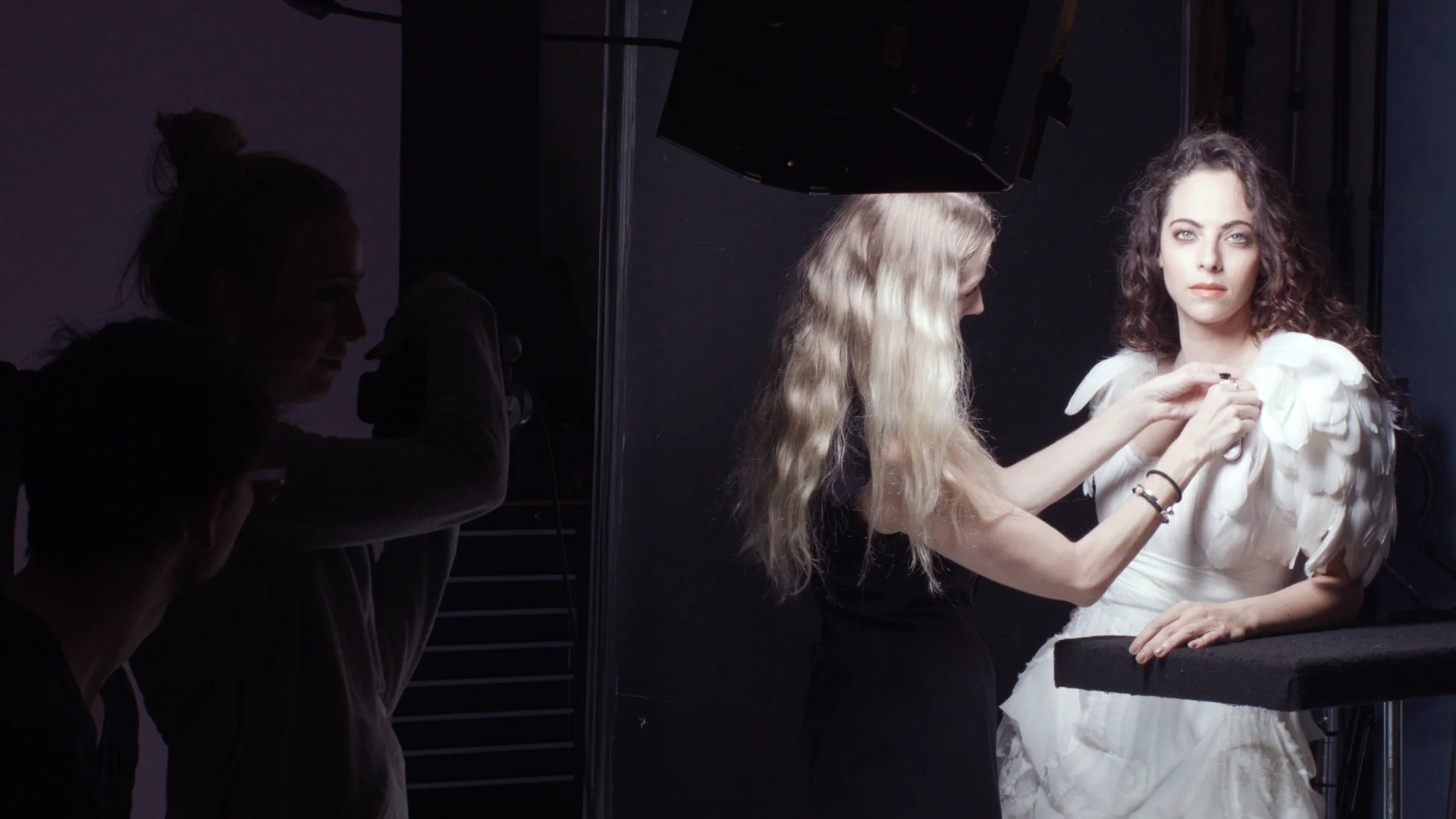 Rebecca in white dress BTS.jpg