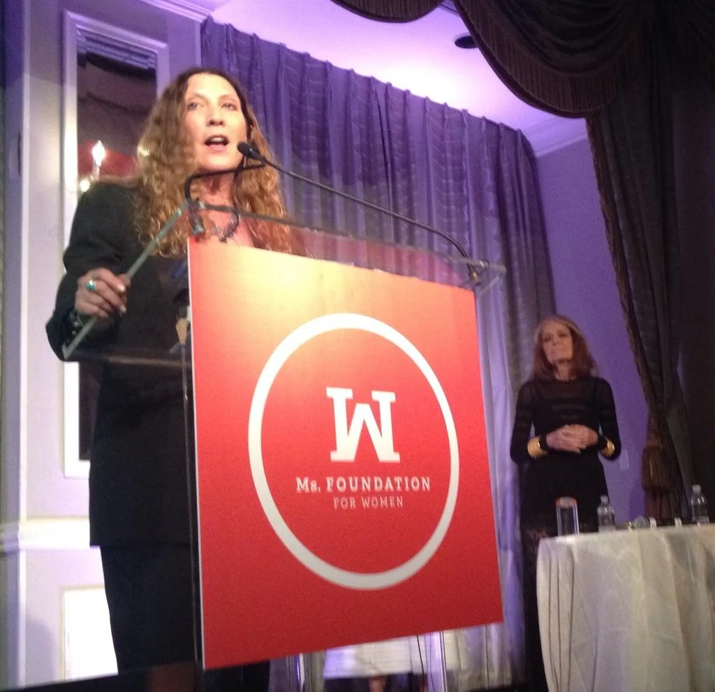 Client Suzanne Lerner, CEO of Michael Stars, accepting Gloria Award from Ms Foundation's Gloria Steinem.