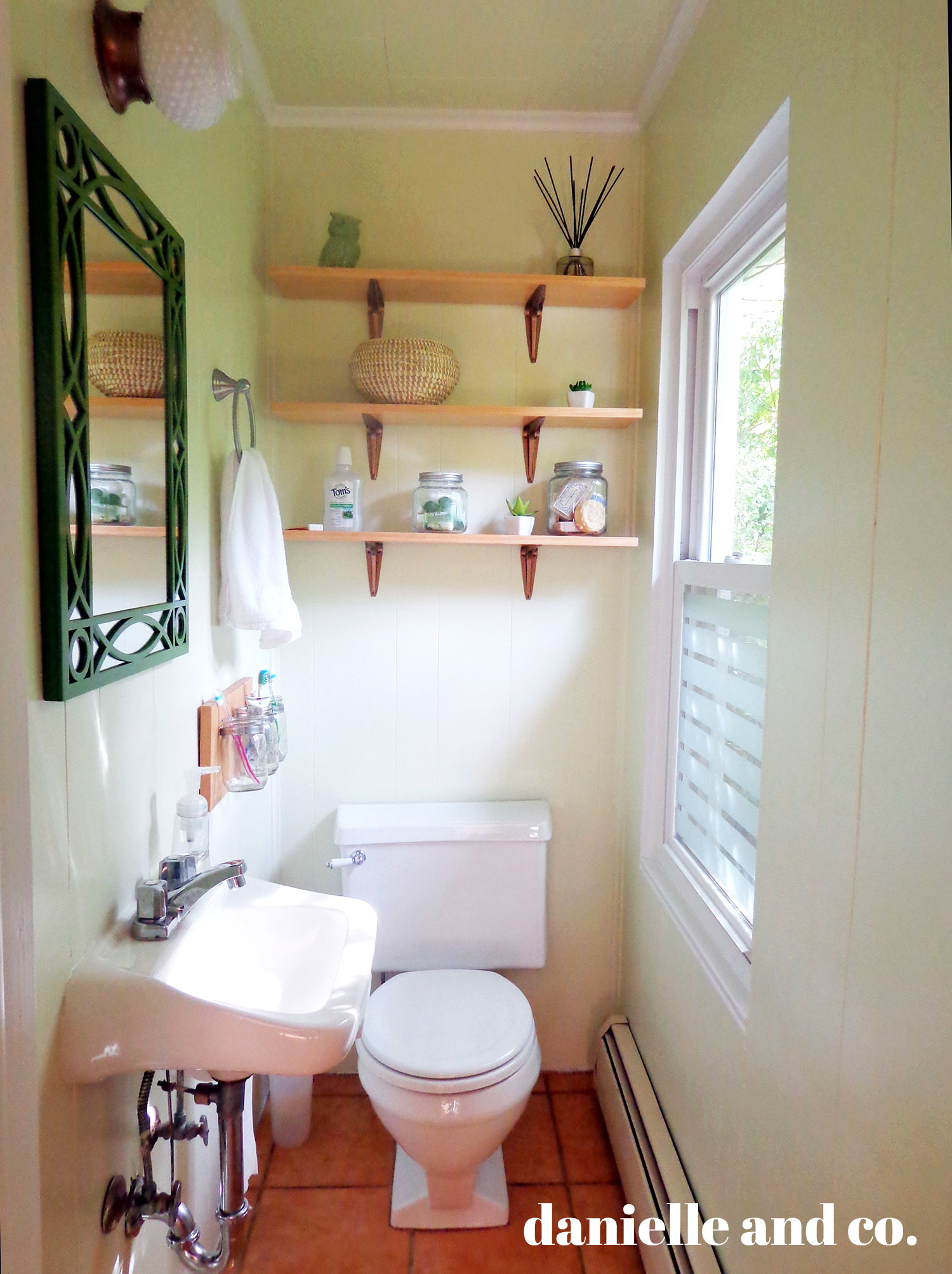 Small bathroom updated with Dark Linen by Benjamin Moore, and DIY shelving! All for just around $200.