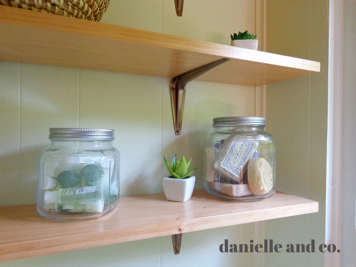 Accessorizing bathroom shelves on a budget, from danielleandco.com