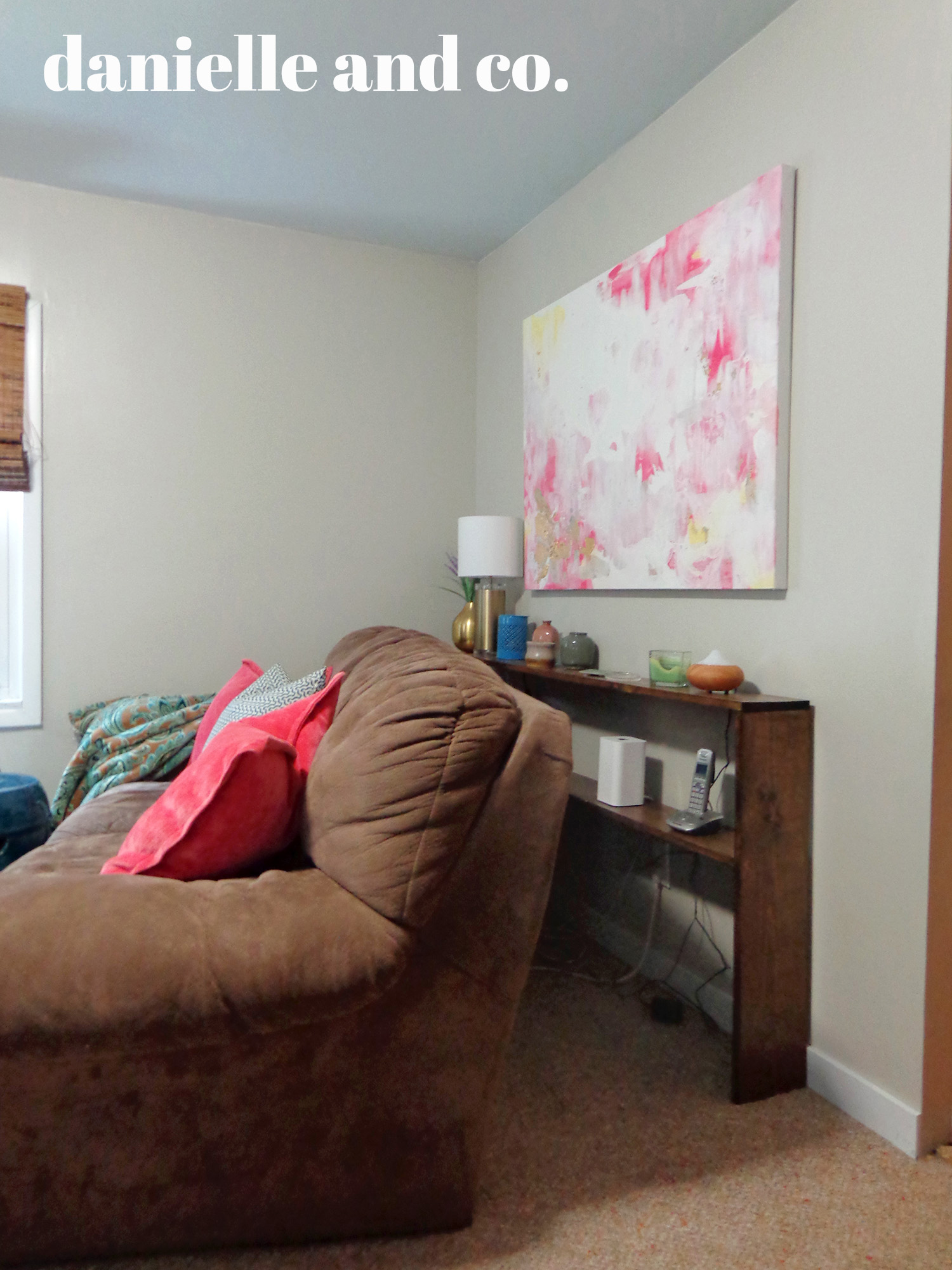 Hiding those &$#% cords with a DIY sofa table! Check out this version and links to other tutorials at danielle and co.